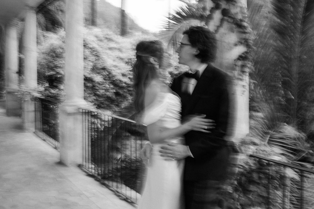 Motion-blurred wedding photos capturing dancing moments on an outdoor terrace.