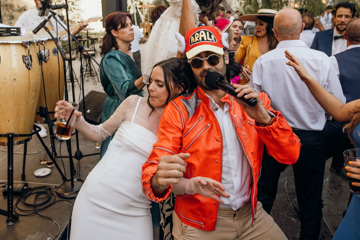A group of people dancing together at what appears to be a lively social gathering or party.