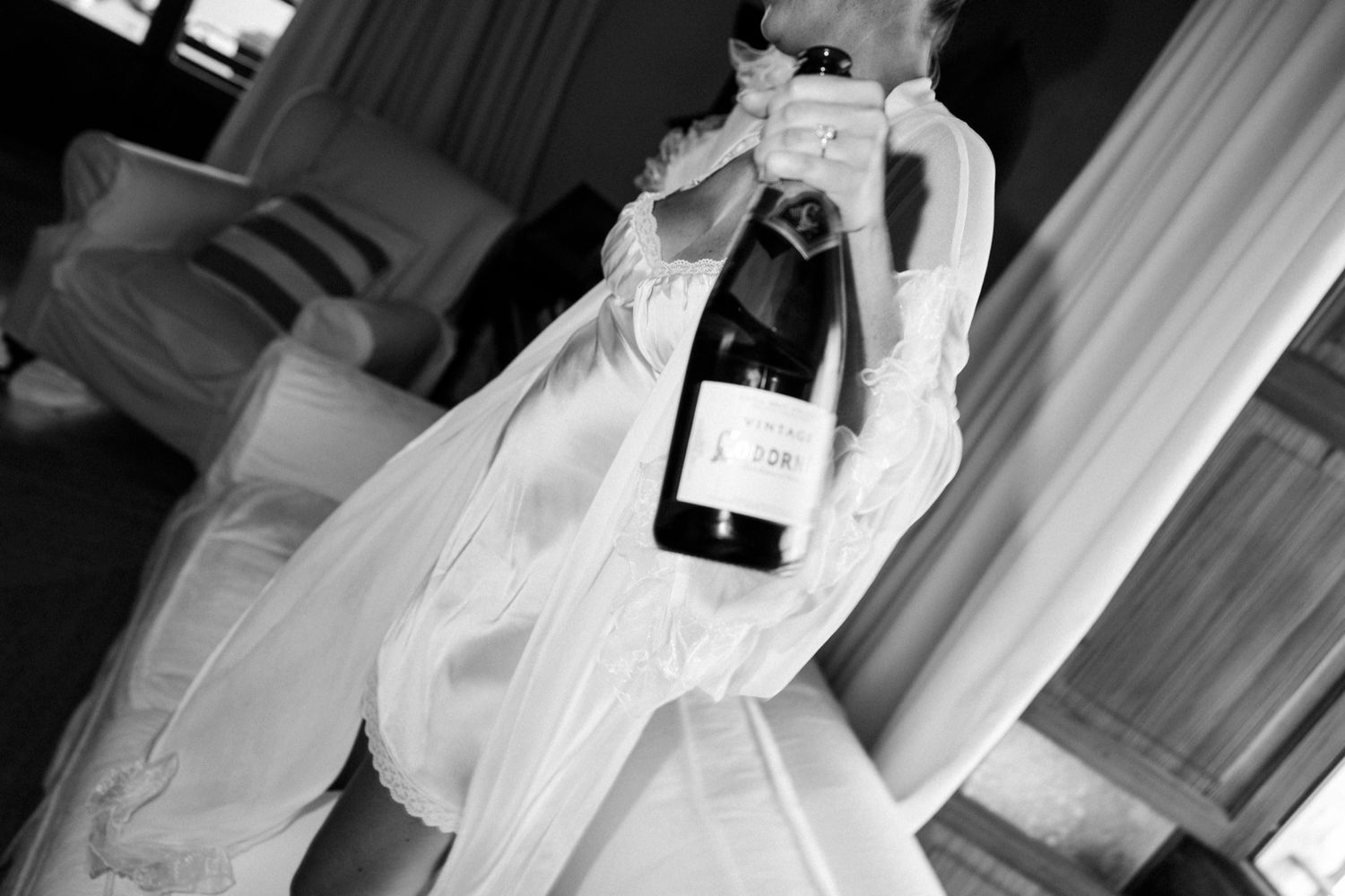 High contrast black and white wedding preparation scenes in an elegant interior.