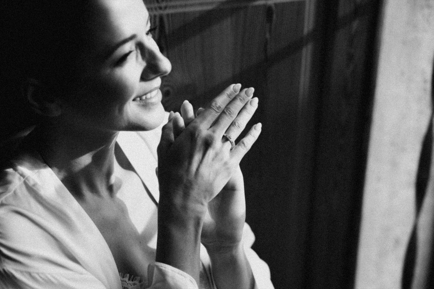 Artistic black and white portrait showing contemplative poses in dramatic lighting.