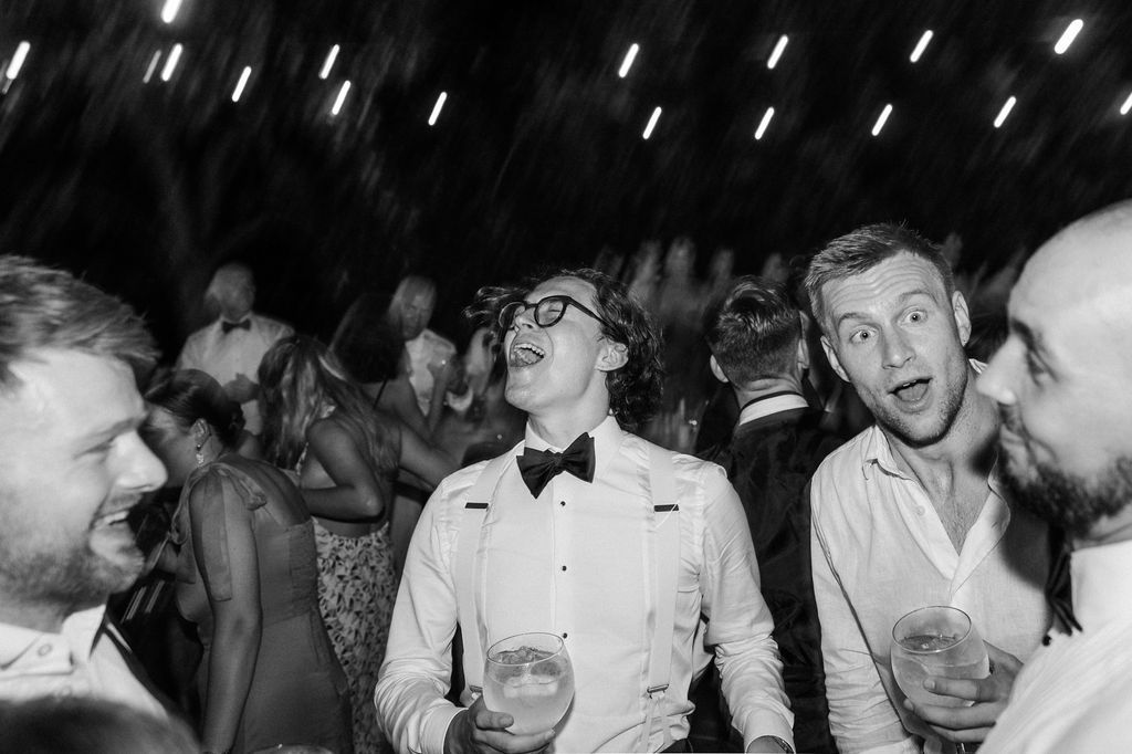 Black and white photos capturing lively dance floor moments at a formal event.