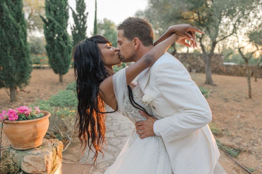 Intimate wedding portraits captured in a sun-drenched Mediterranean garden.