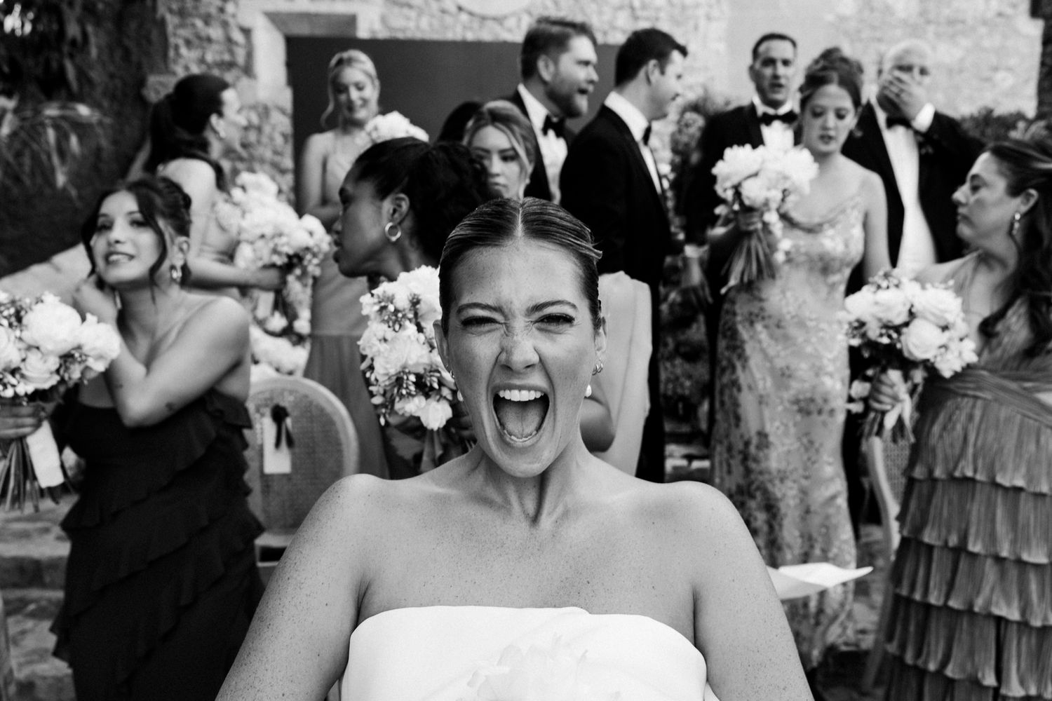 Candid celebration moments captured during outdoor wedding reception.
