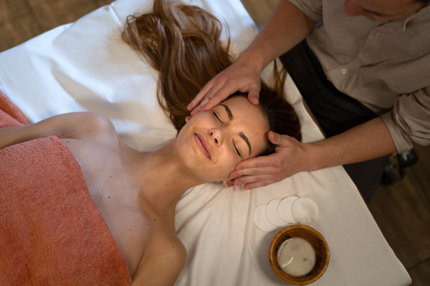 Close-up sequence of a relaxing massage therapy session showing hands performing therapeutic techniques.