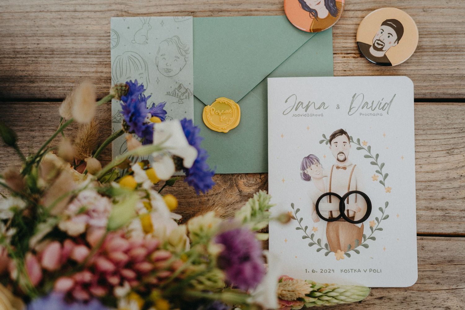 Wedding rings and jewelry details arranged artistically on rustic wooden surfaces with romantic floral accents and decorative cards.