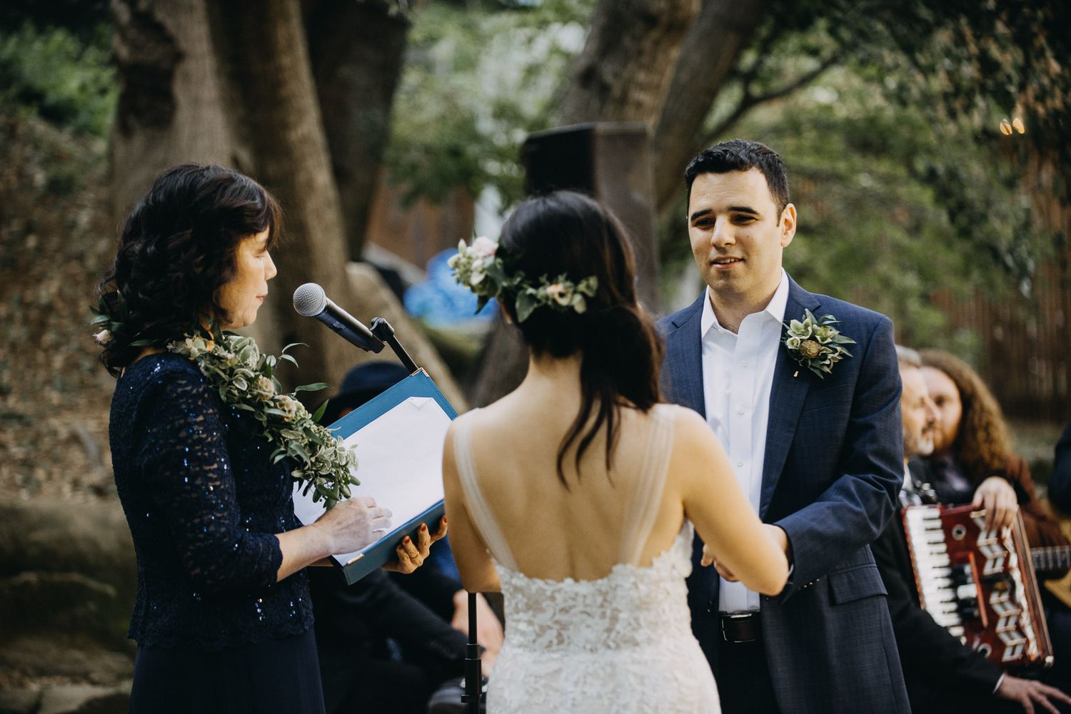 Wedding ceremony sequence showing couple exchanging vows in an outdoor forest setting.
