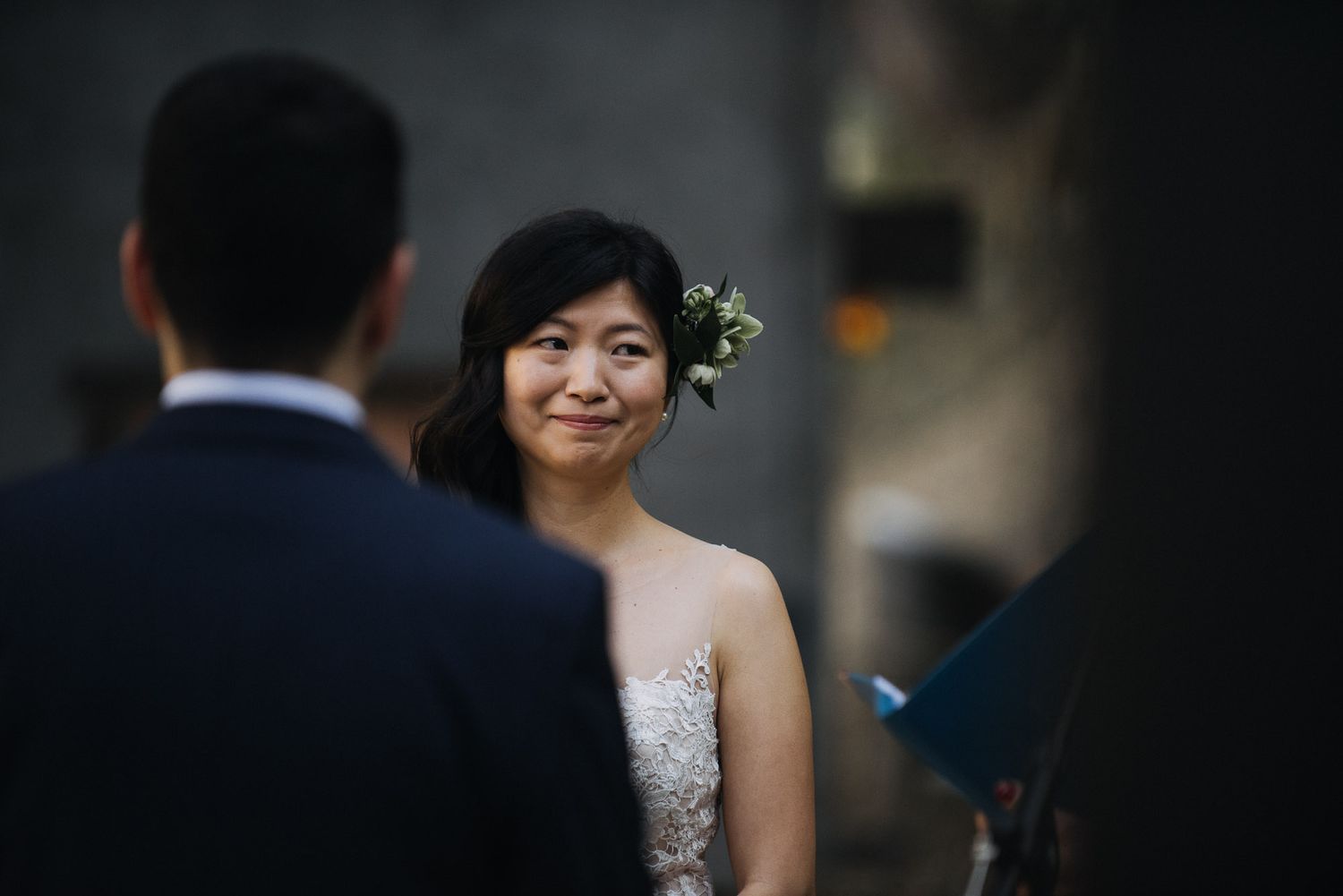 A bride and groom share intimate moments during their wedding celebration in an outdoor setting.