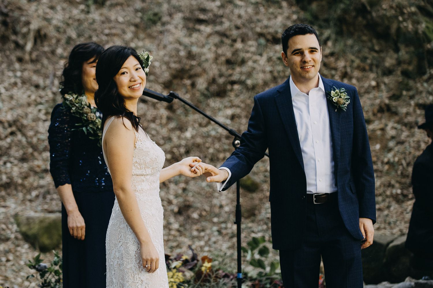 A romantic wedding moment captured in a series of candid photos showing the couple against a stone wall background.