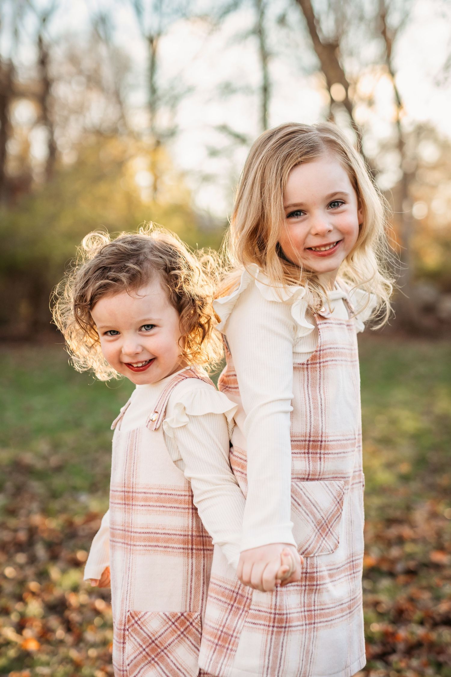 A series of four connected photos showing joyful moments captured in warm autumn sunlight among fallen leaves.