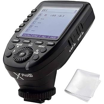 Multiple views of a black Godox XPro wireless camera flash trigger with LCD display screen and control buttons.