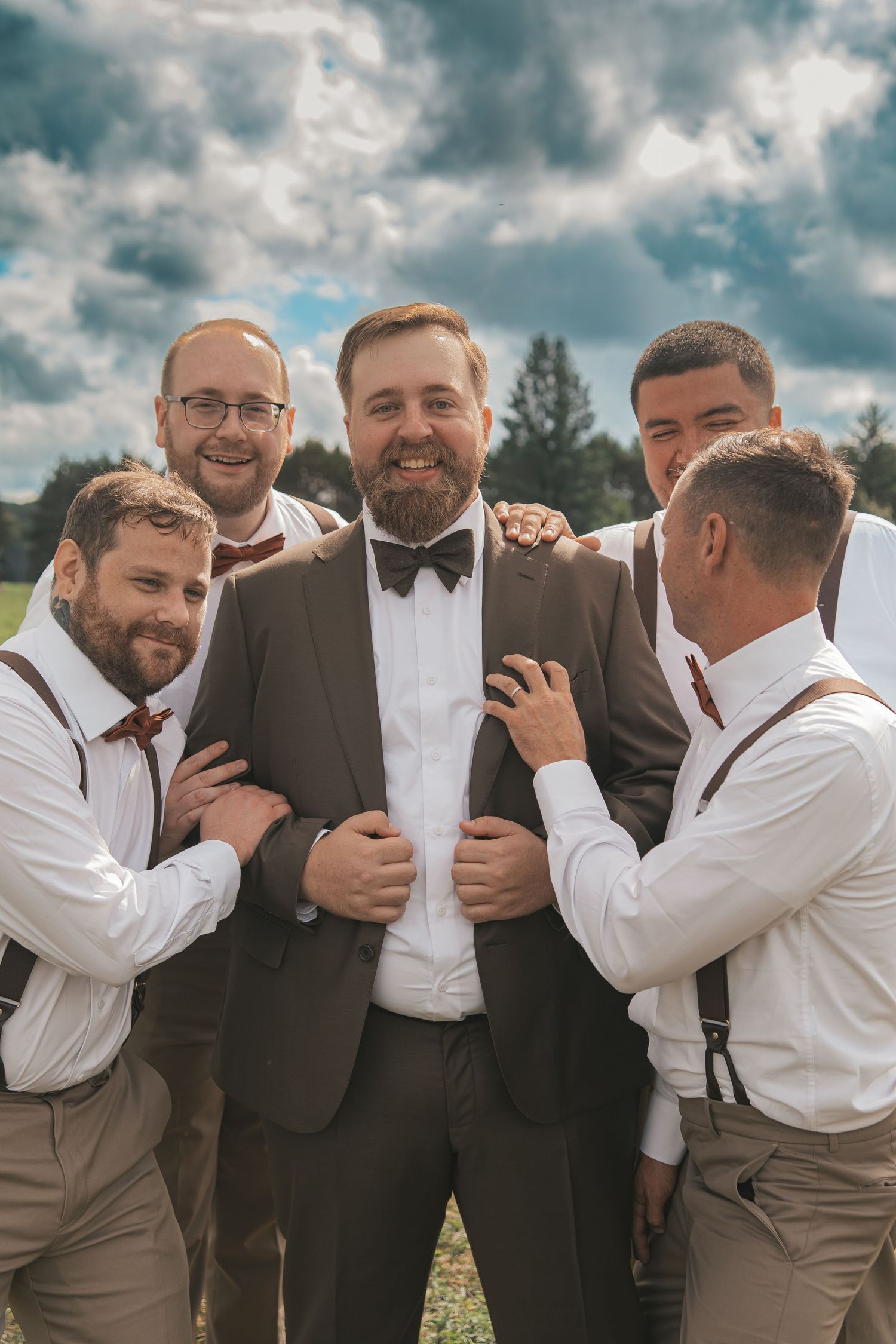 A sequence of candid moments showing groomsmen laughing and embracing during outdoor wedding photos.