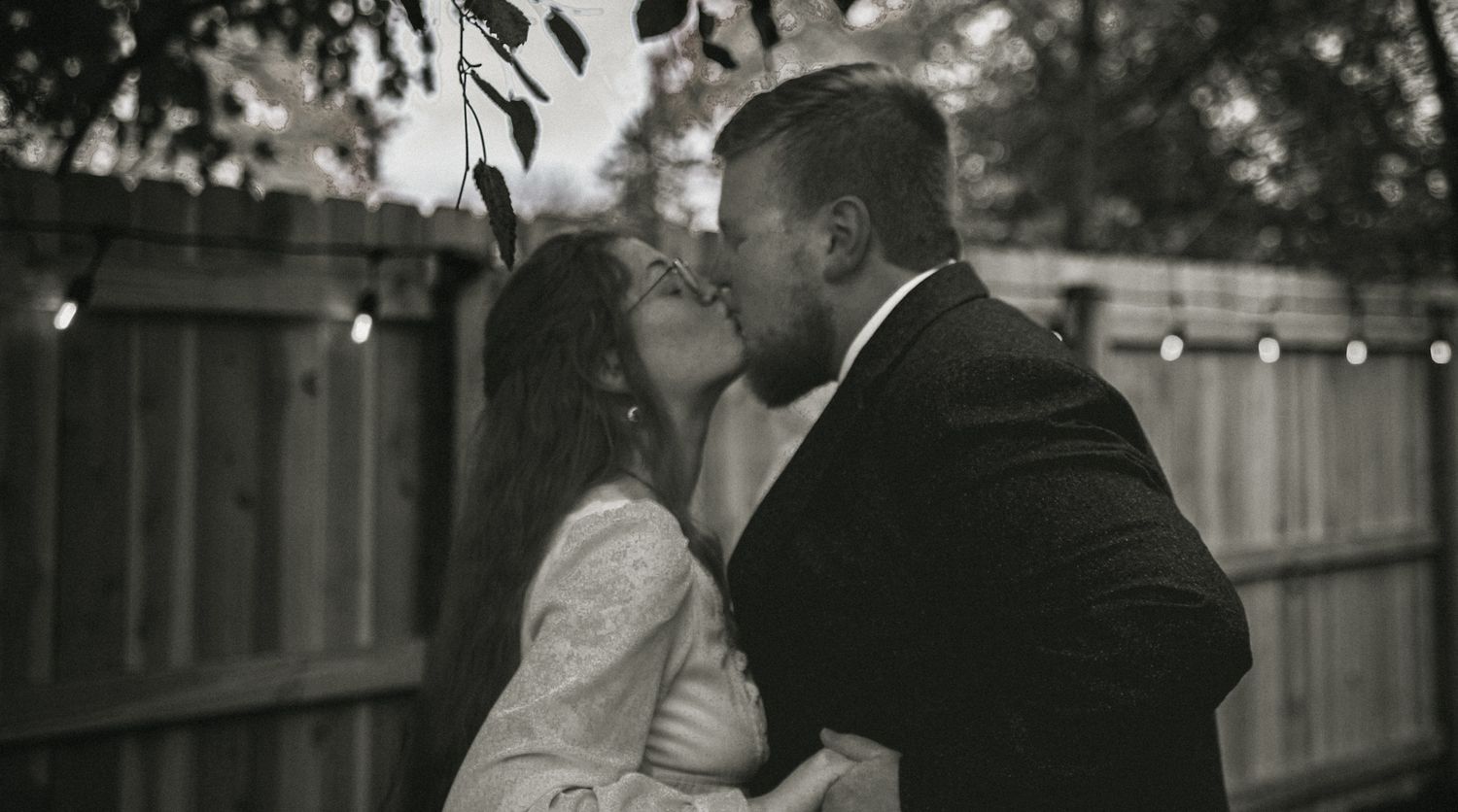 A black and white wedding photo montage showing romantic moments between a couple during their celebration.