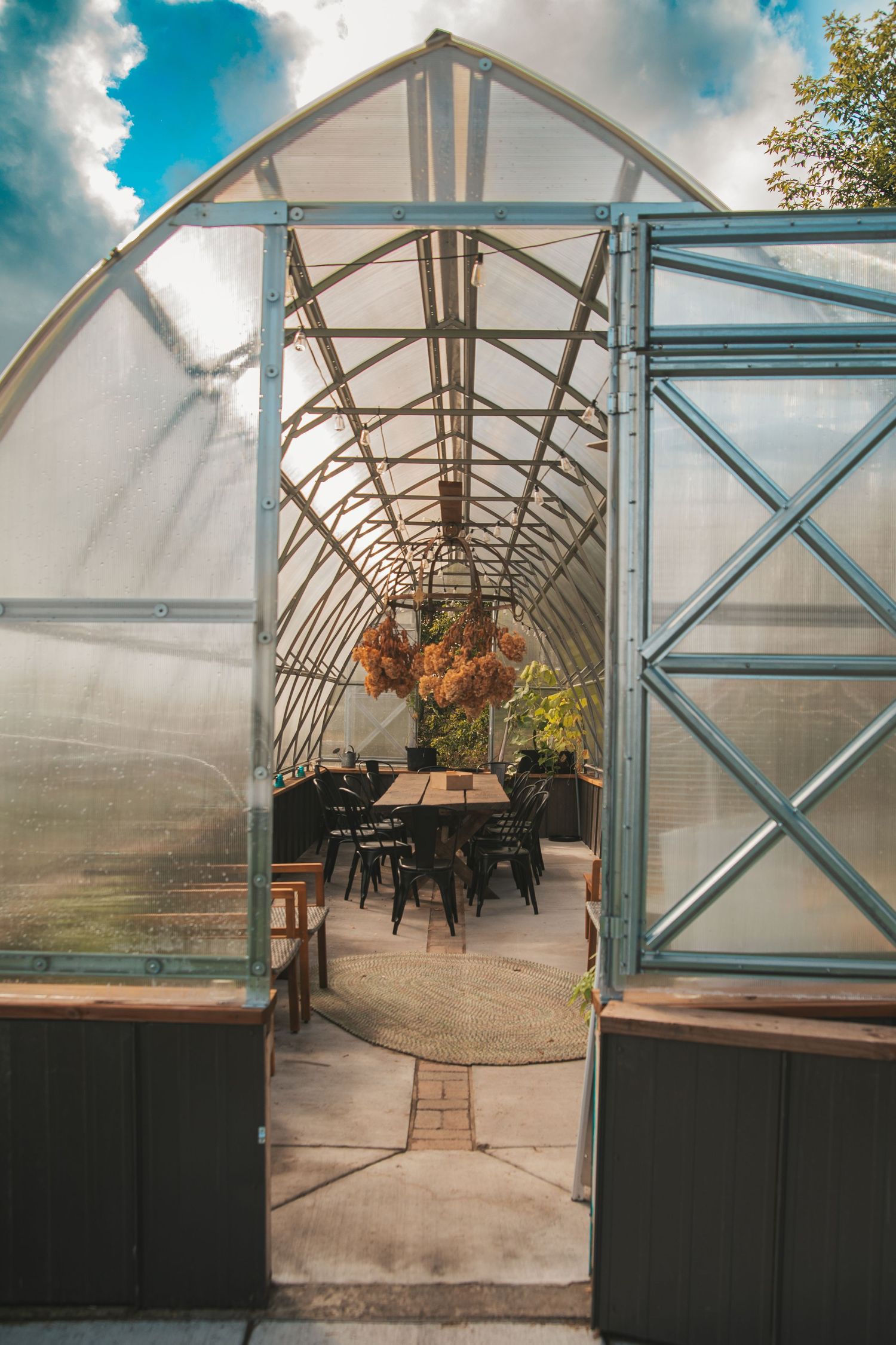 A sequence of greenhouse interior views showing tables and seating arrangements under translucent panels and metal framing.