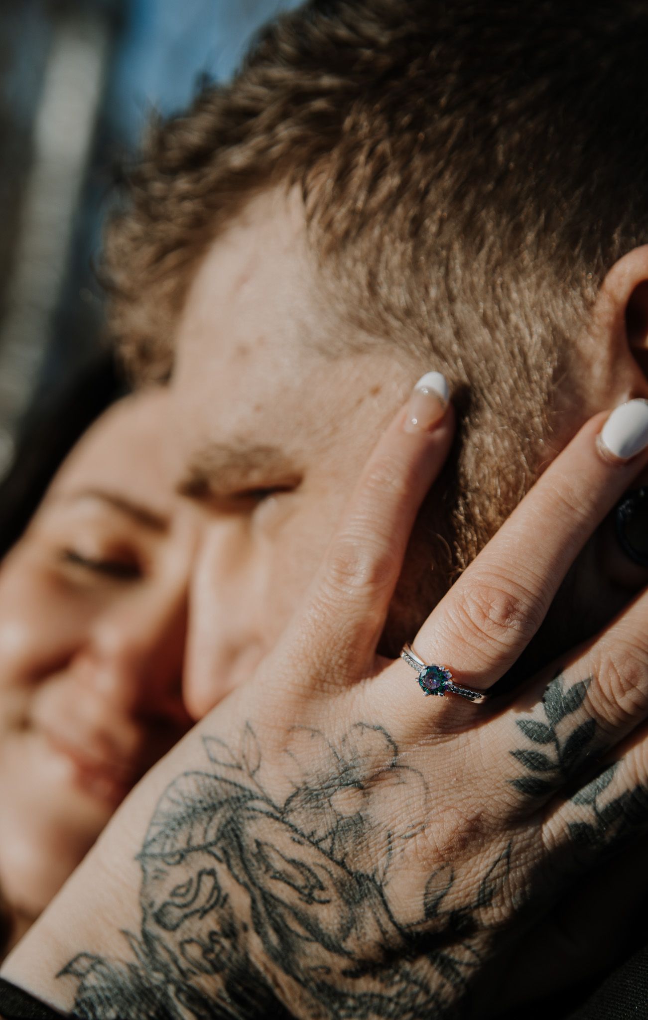Close-up series of neck tattoos showing intricate black and grey designs in natural lighting.
