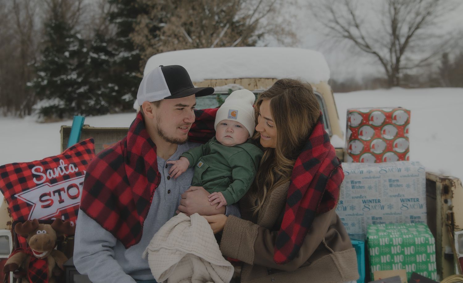 A collection of winter family photos shows people embracing and smiling together in snowy outdoor settings.