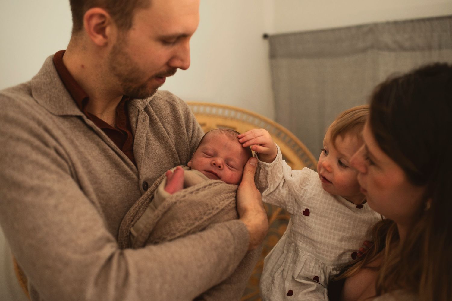 Loving family moment as they bond with their newborn baby.