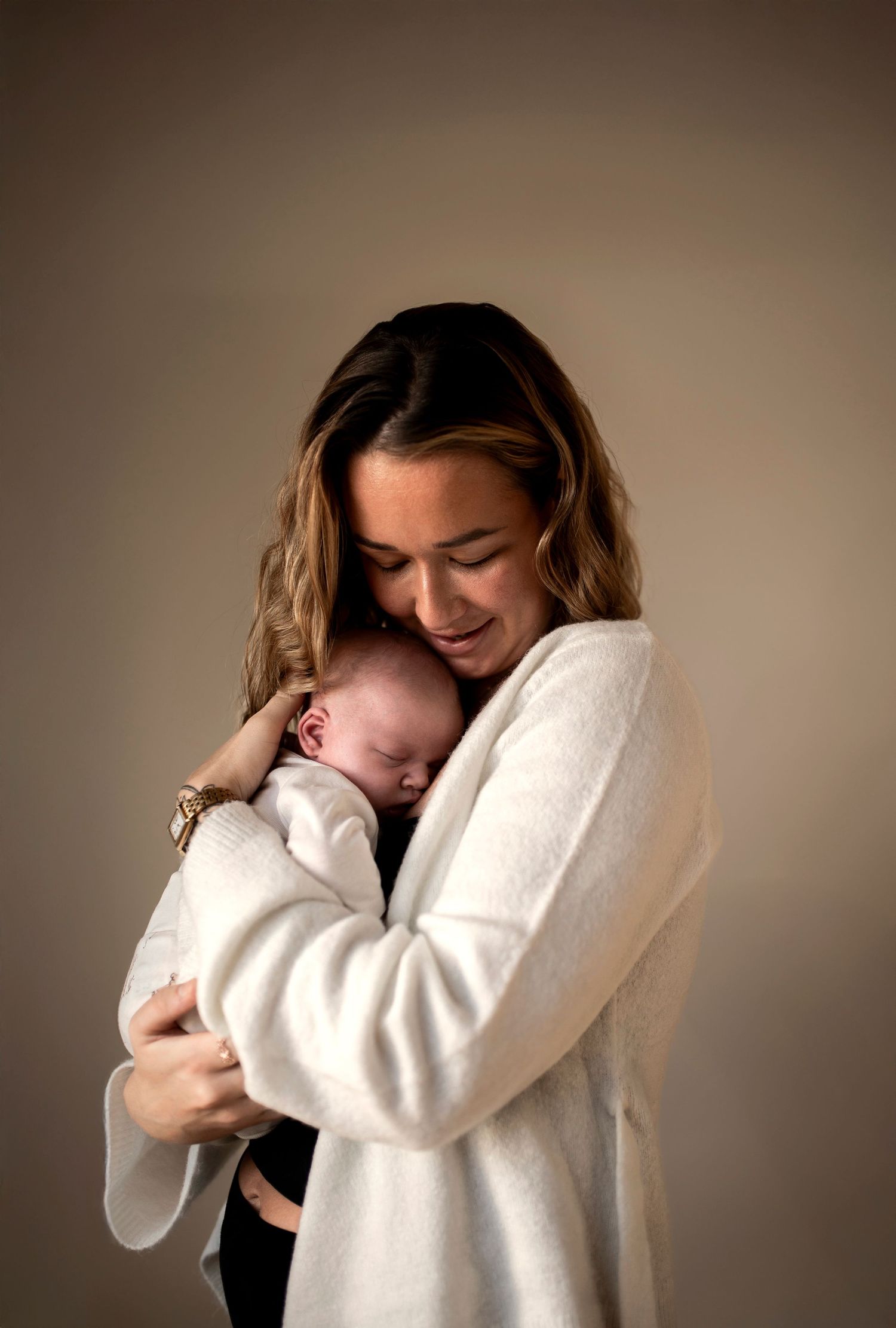 Person in white sweater showing emotional distress and vulnerability against neutral background in series of photos.
