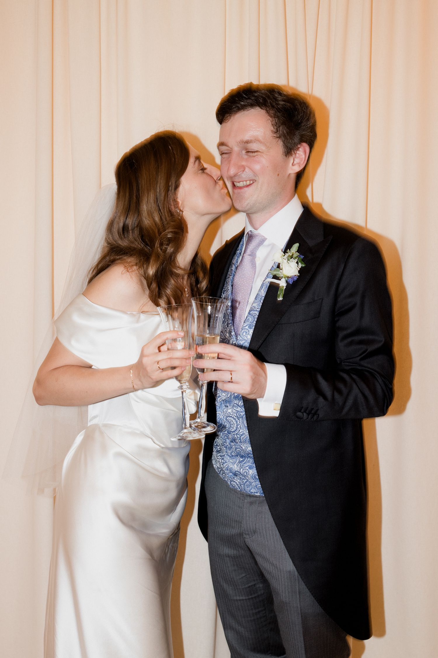 A couple in wedding attire shares a romantic champagne toast in a series of progressive frames. Paris wedding photographer