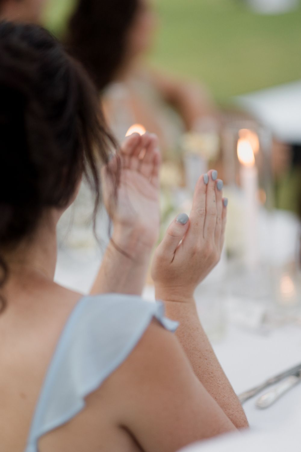 Sequential images show hands clapping together against a soft-focused background with table settings.