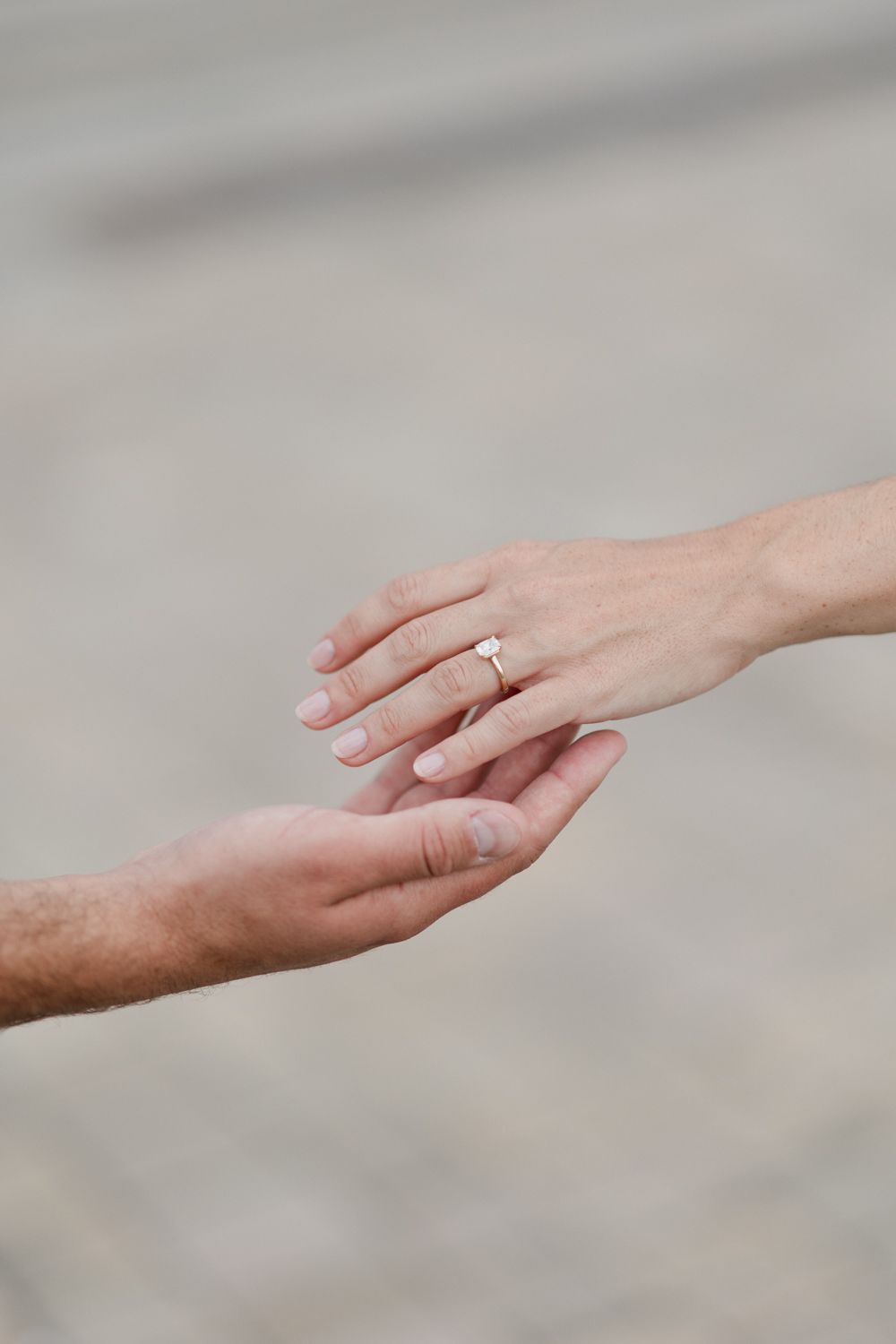 Several hands reach towards each other in a conceptual sequence depicting connection and unity against a grey background.