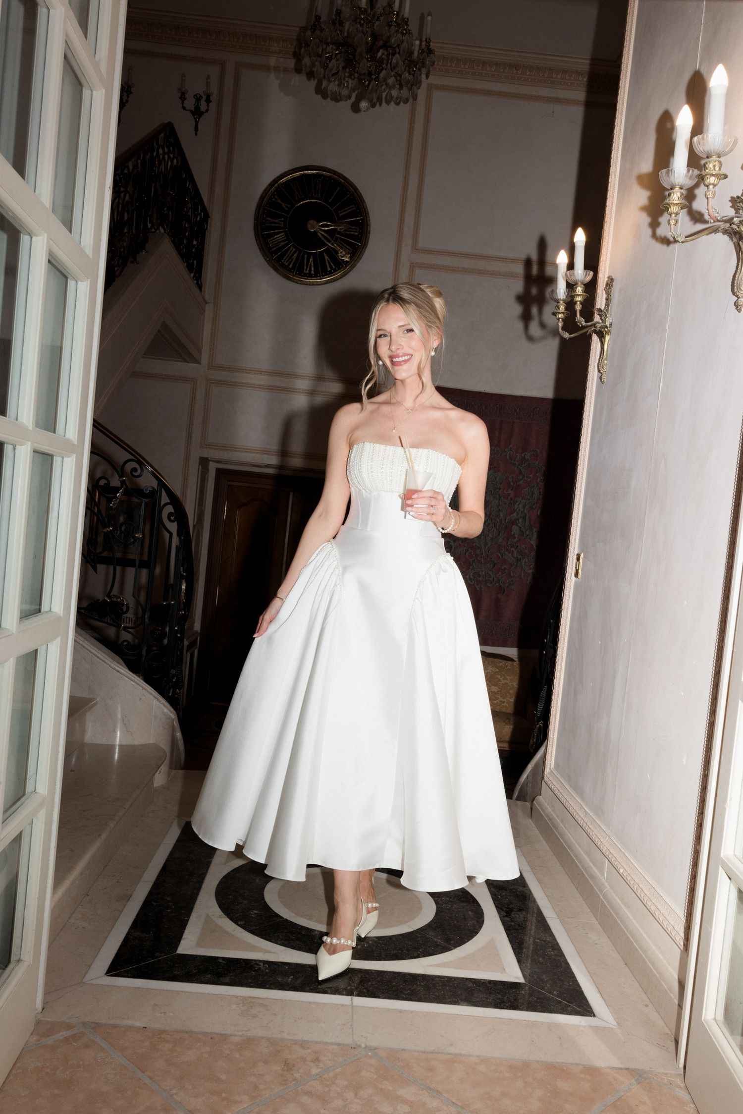 A collage of bridal portraits showing someone in a white strapless wedding dress posing in an elegant room with chandeliers.