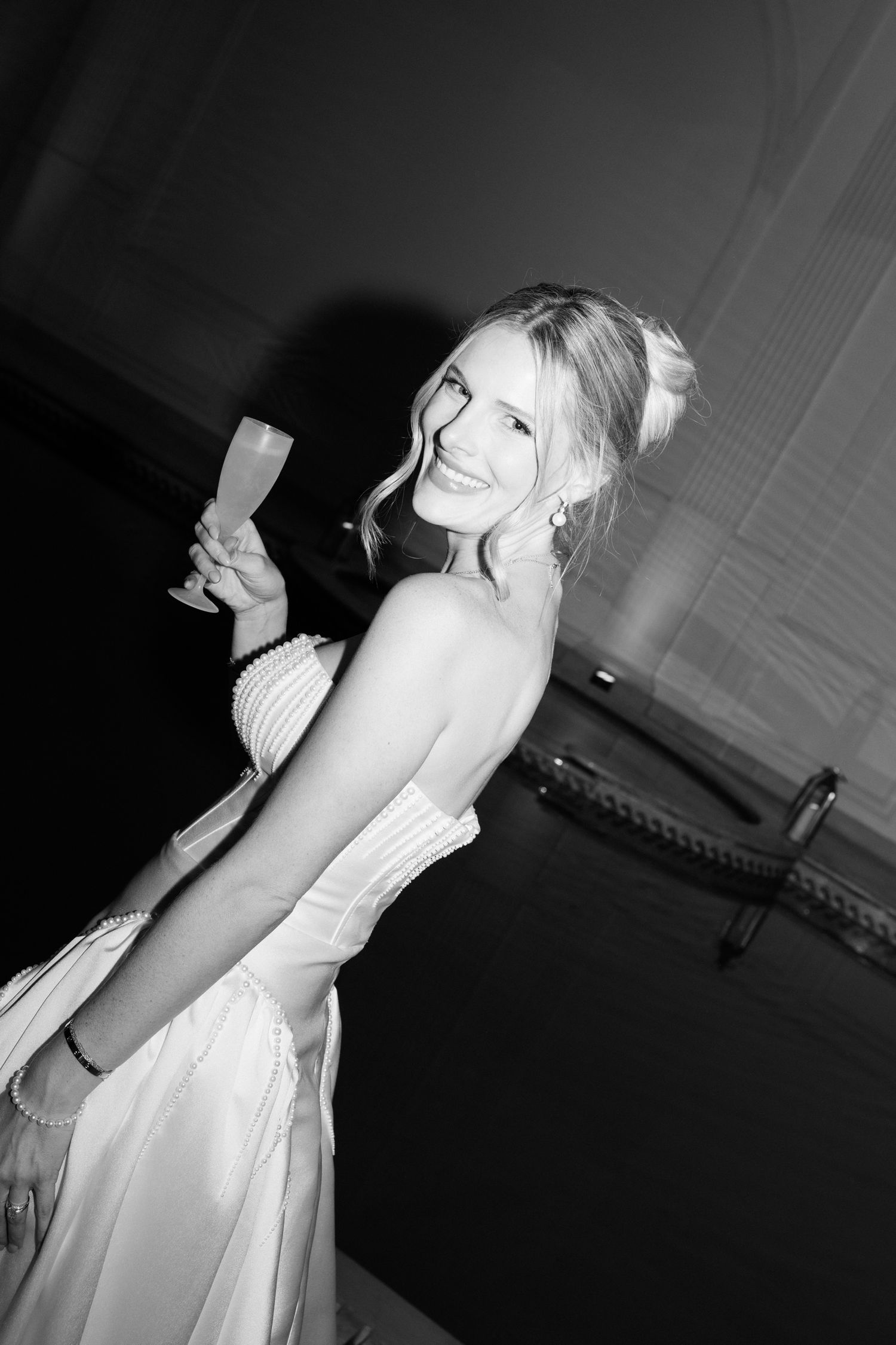 A figure in a white dress captured in a moody black and white photo sequence. Editorial wedding photographer french riviera