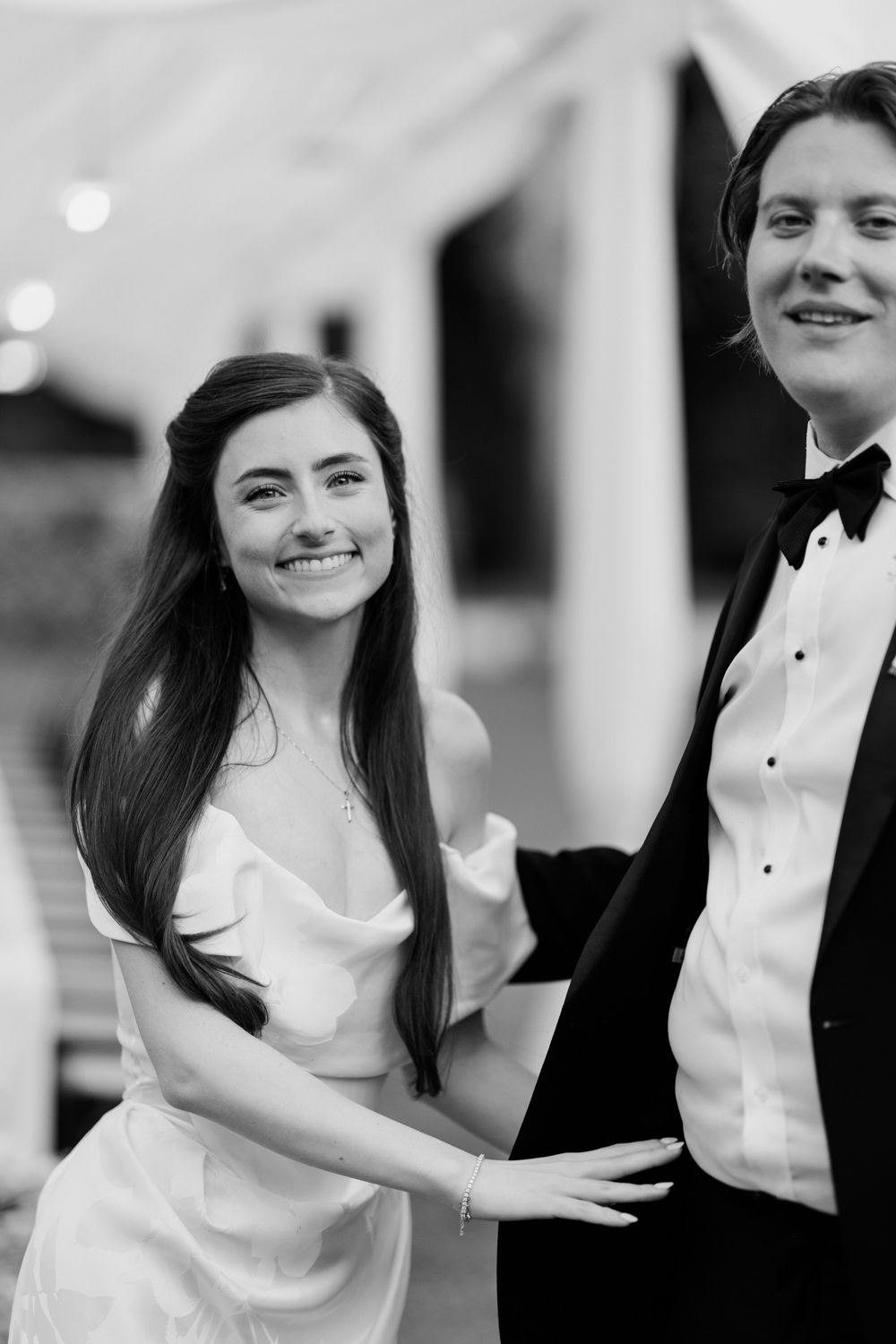 Black and white photo of a bride and groom at a wedding celebration showing joyful emotion. Château des 3 Fontaines wedding Provence