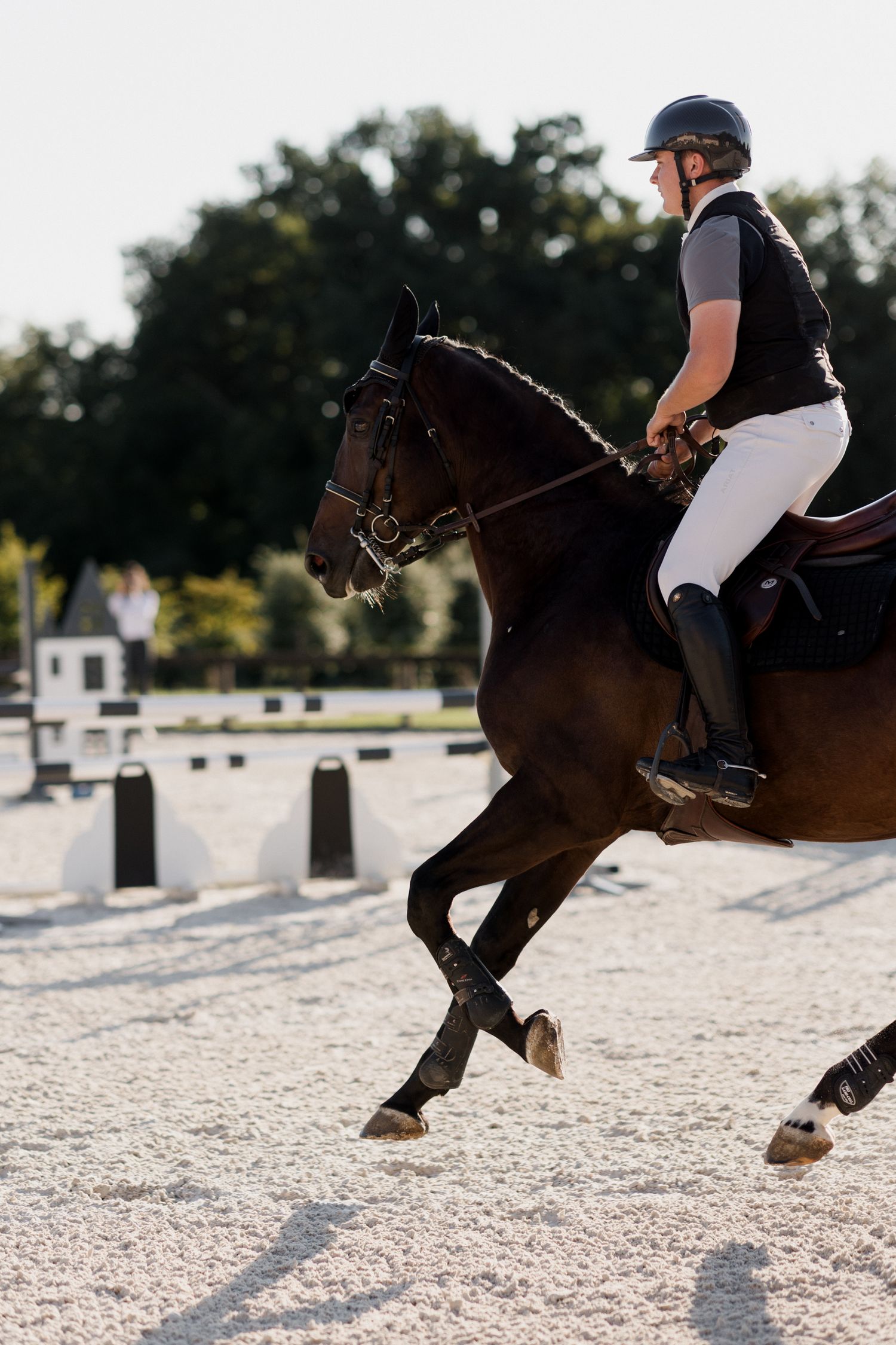 Close-up sequence showing a horse's hooves and legs jumping over obstacles in an equestrian competition.