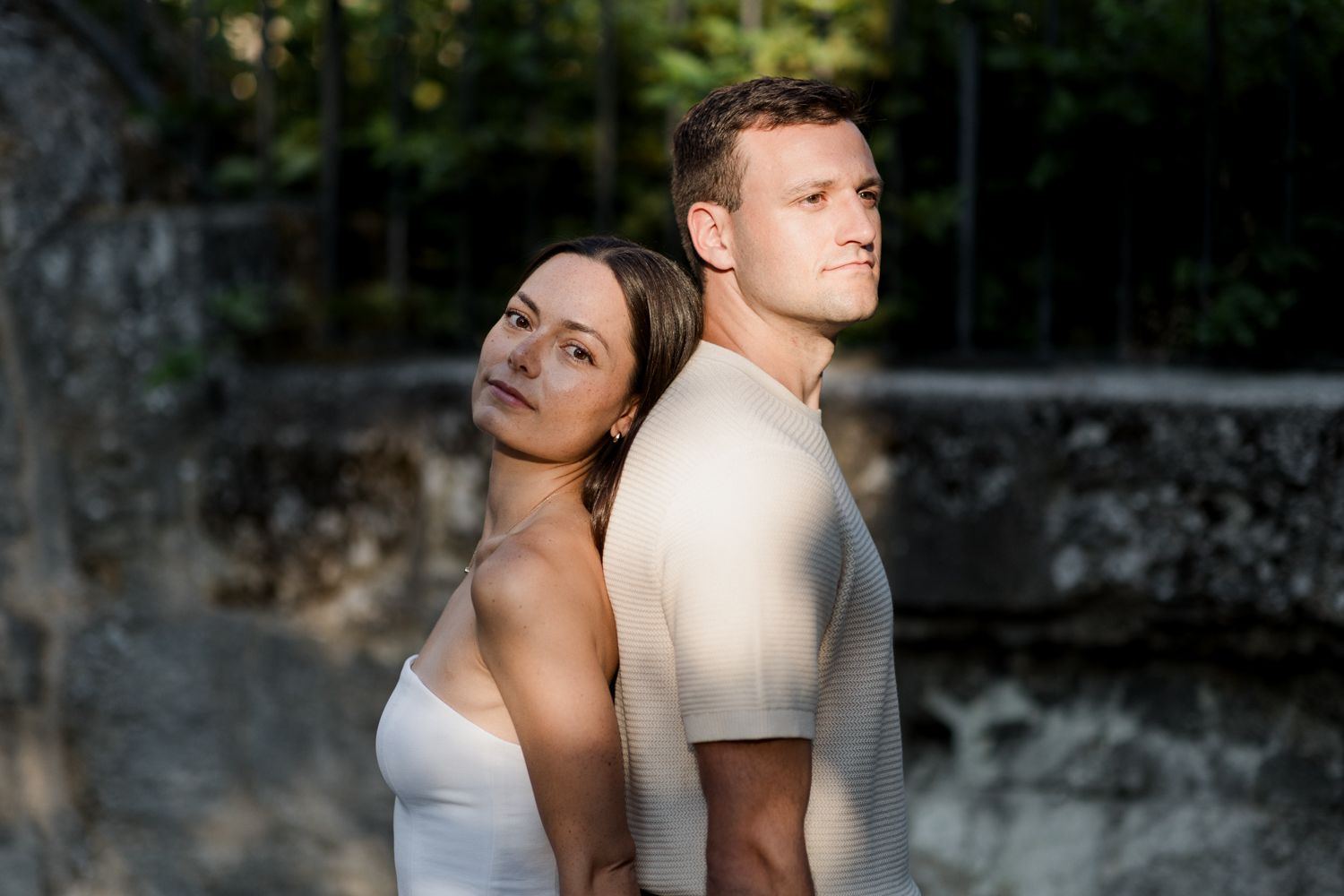 Romantic engagement photo session captured in warm natural lighting.