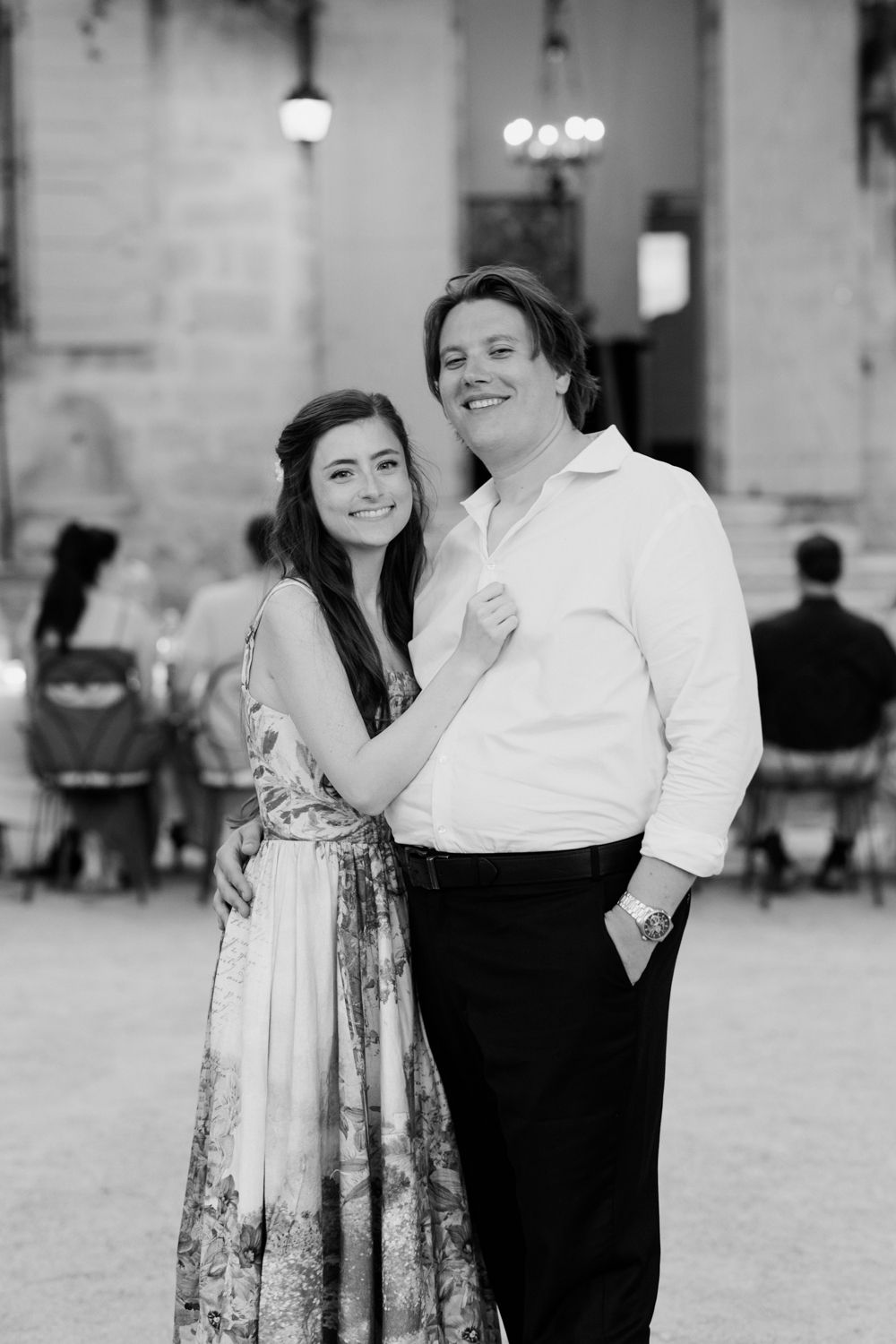 Black and white engagement photo series showing a couple dancing and embracing in a romantic outdoor setting.