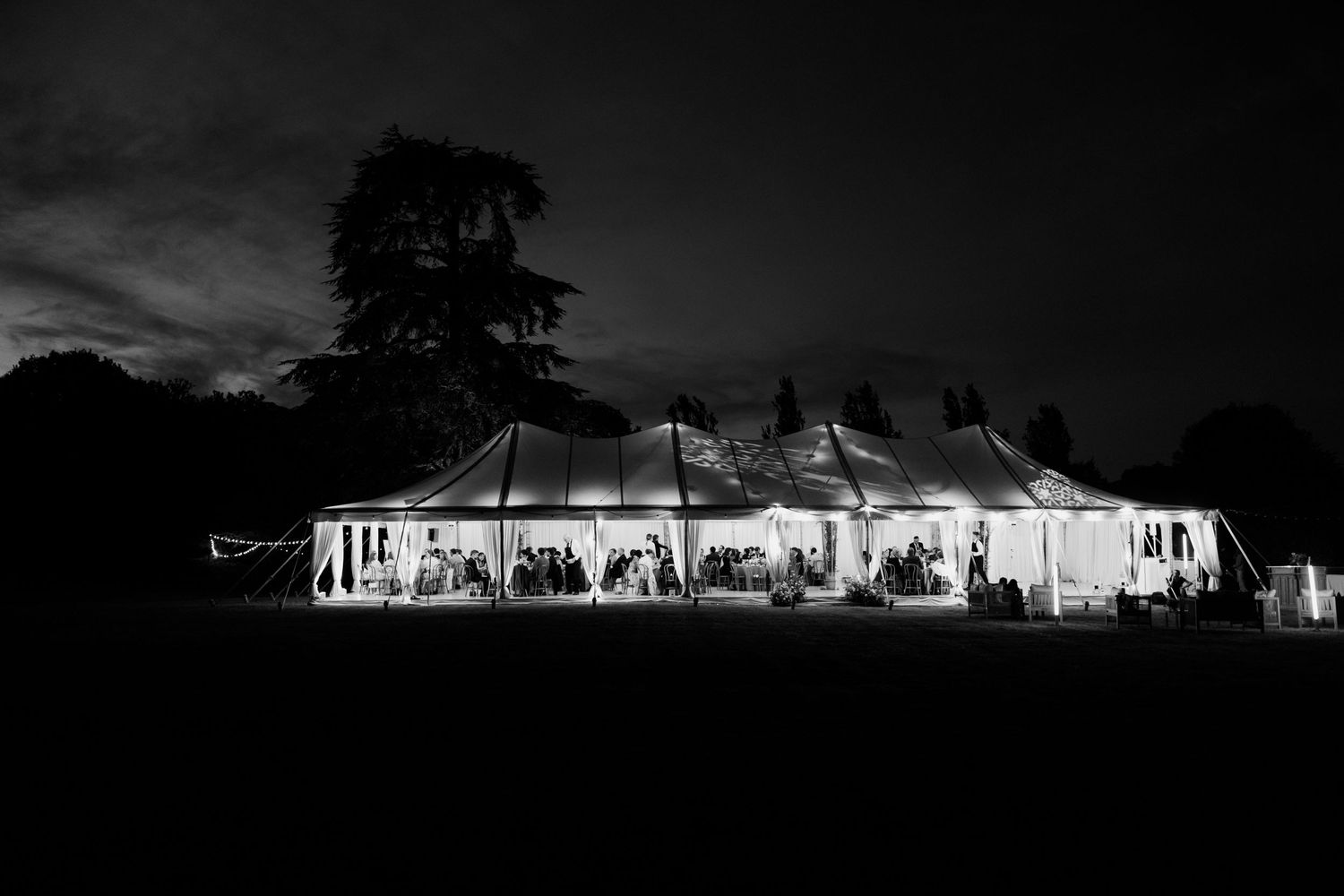 A dramatic black and white series of architectural silhouettes against a moody sky at dusk. Paris wedding photographer