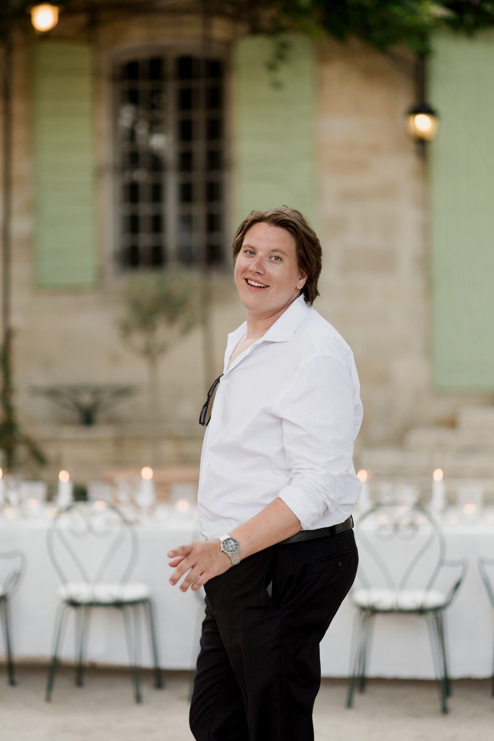 Candid photo series of a server in a white shirt and black pants at an outdoor restaurant patio.