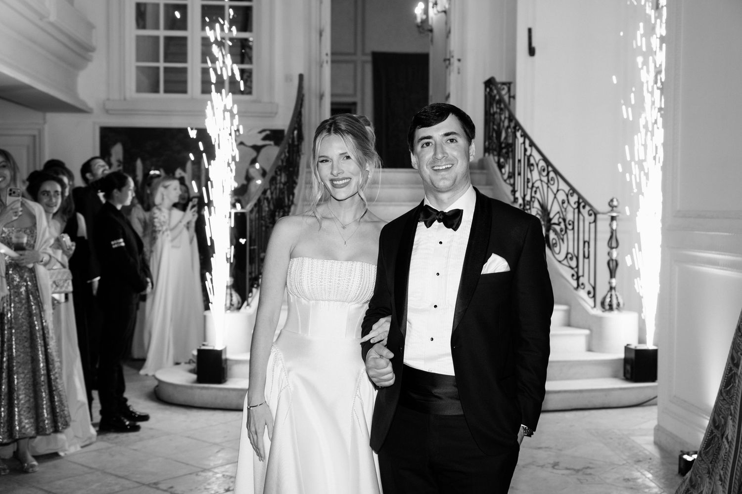 A series of black and white wedding photos showing couples and guests celebrating at an elegant indoor venue. Editorial wedding photographer