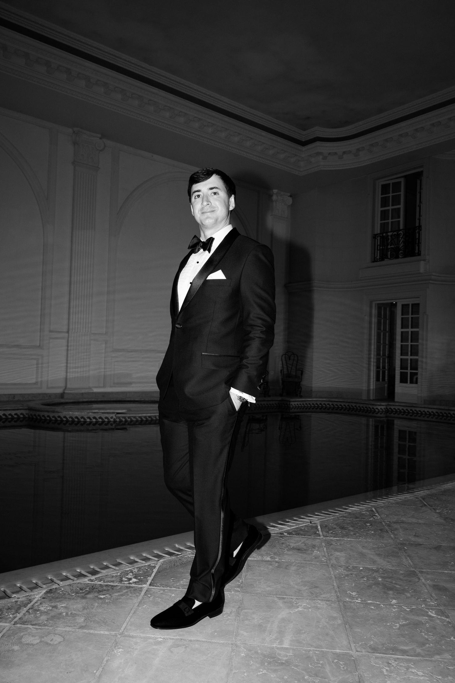 Black and white photo series showing a person in formal attire posing dramatically in an empty room. editorial wedding photographer france