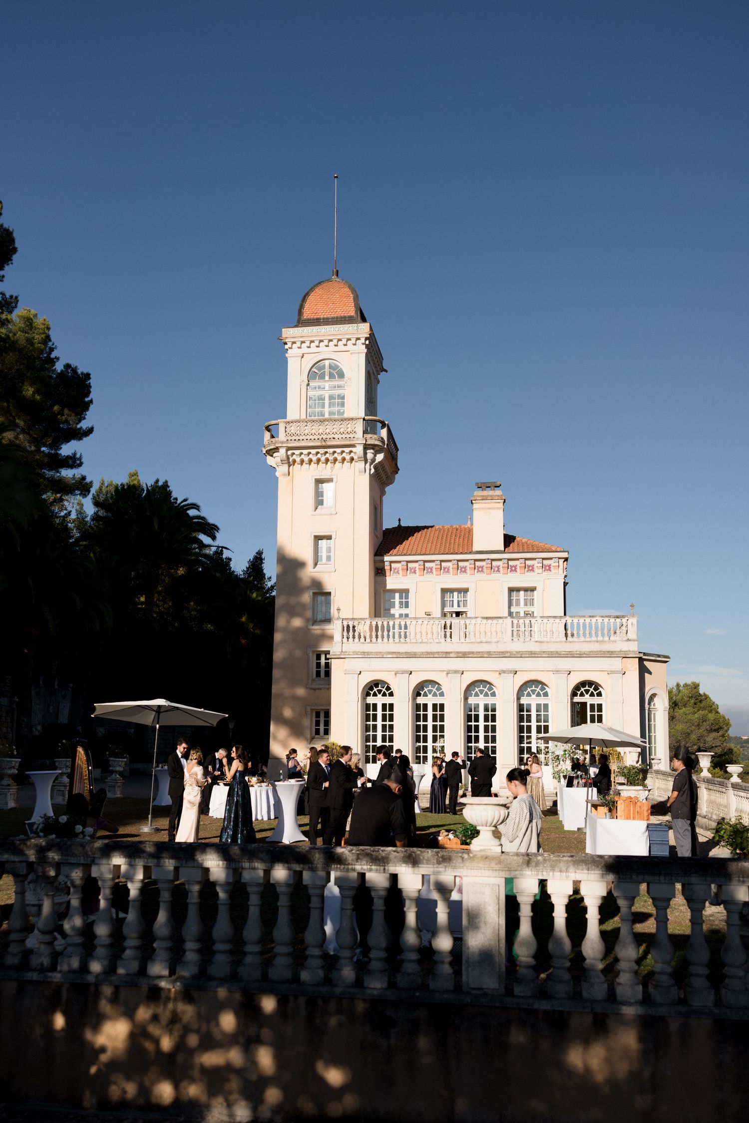 Historic white observatory building with domed tower and Mediterranean architectural style shown from multiple angles.