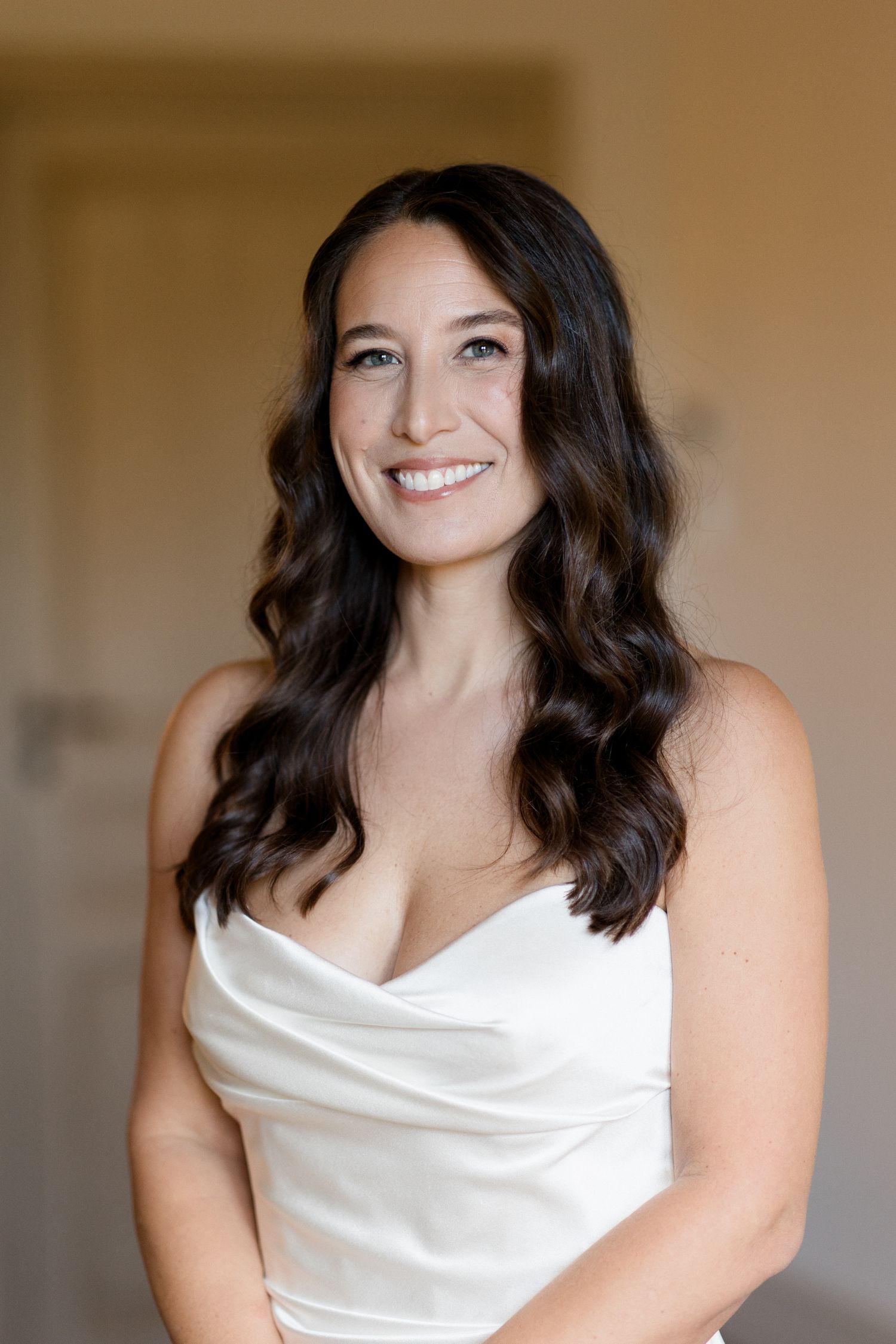 A series of portrait photos showing someone wearing a white sleeveless dress against a neutral background. Editorial wedding photographer