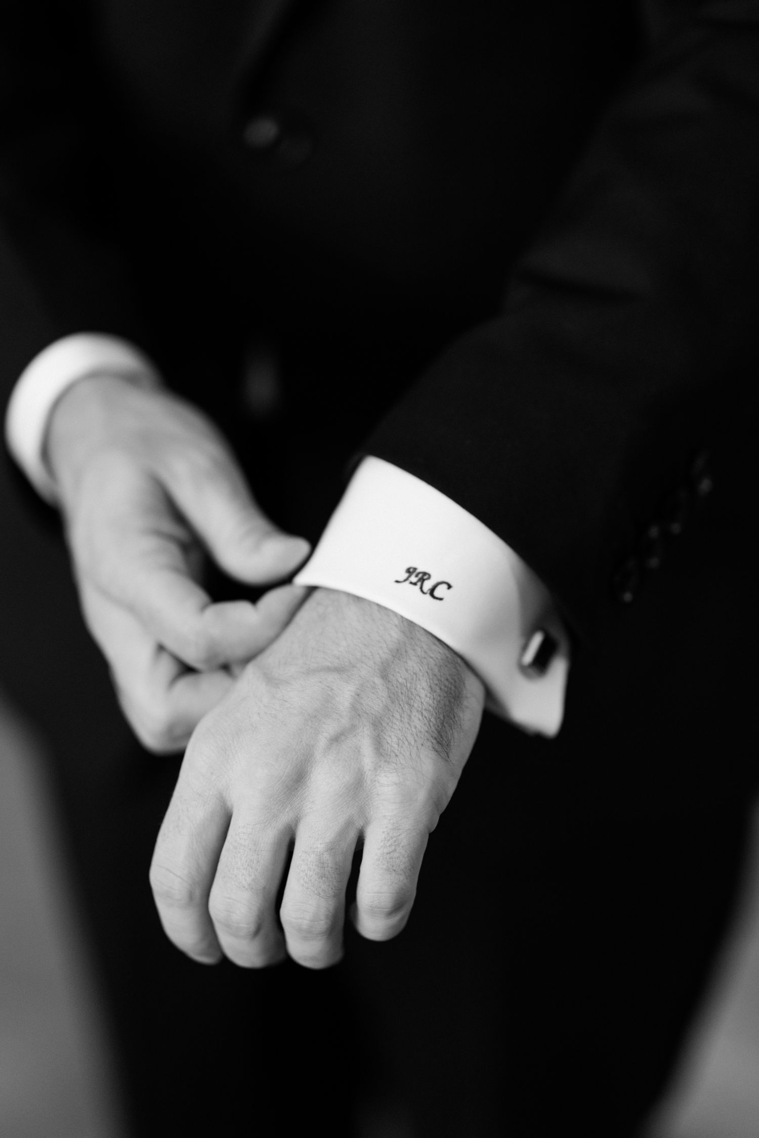 A series of black and white photographs showing hands adjusting white shirt cuffs in a formal setting.