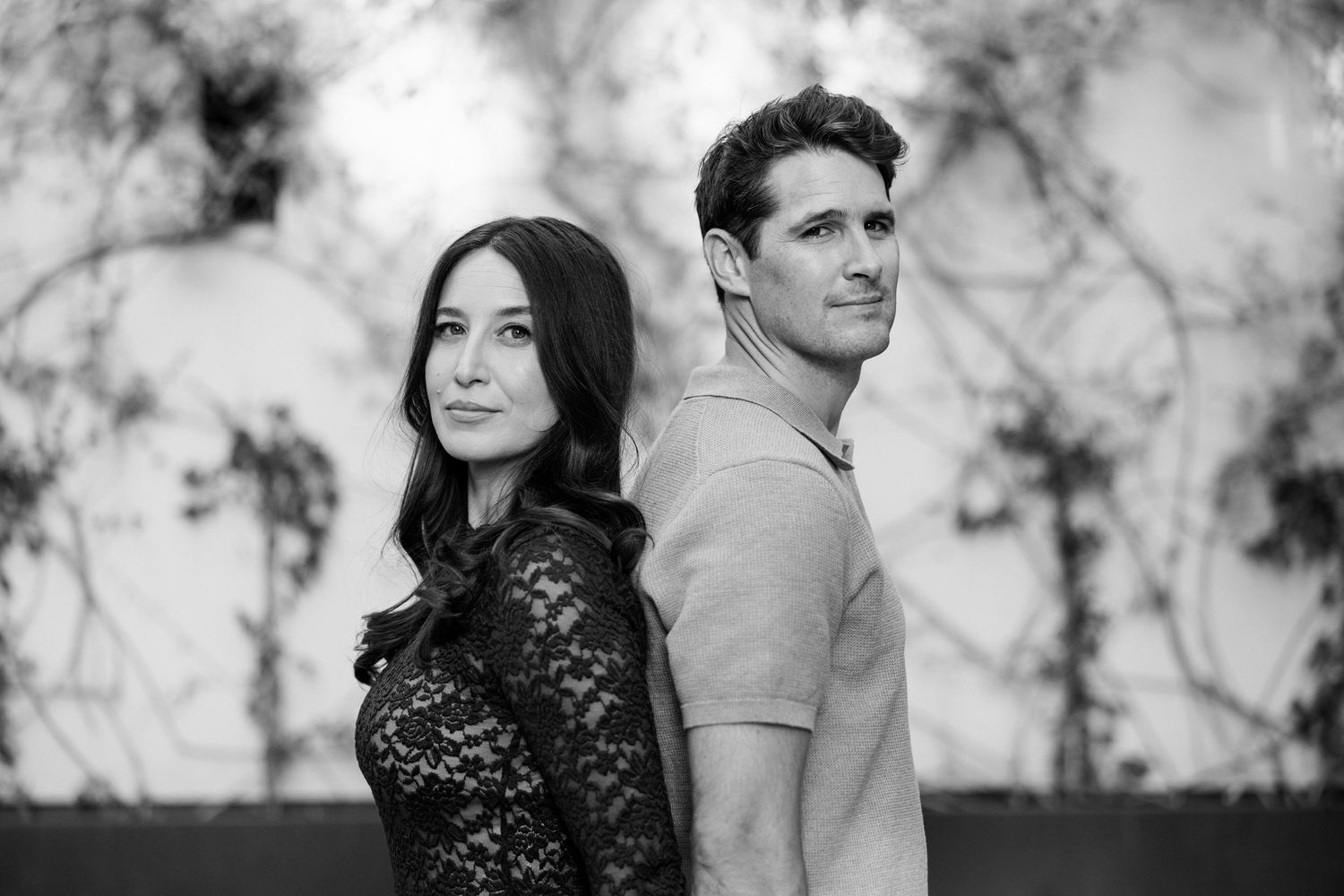 Black and white romantic engagement photos showing couple in an intimate pose against a marble background. Saint Remy de Provence