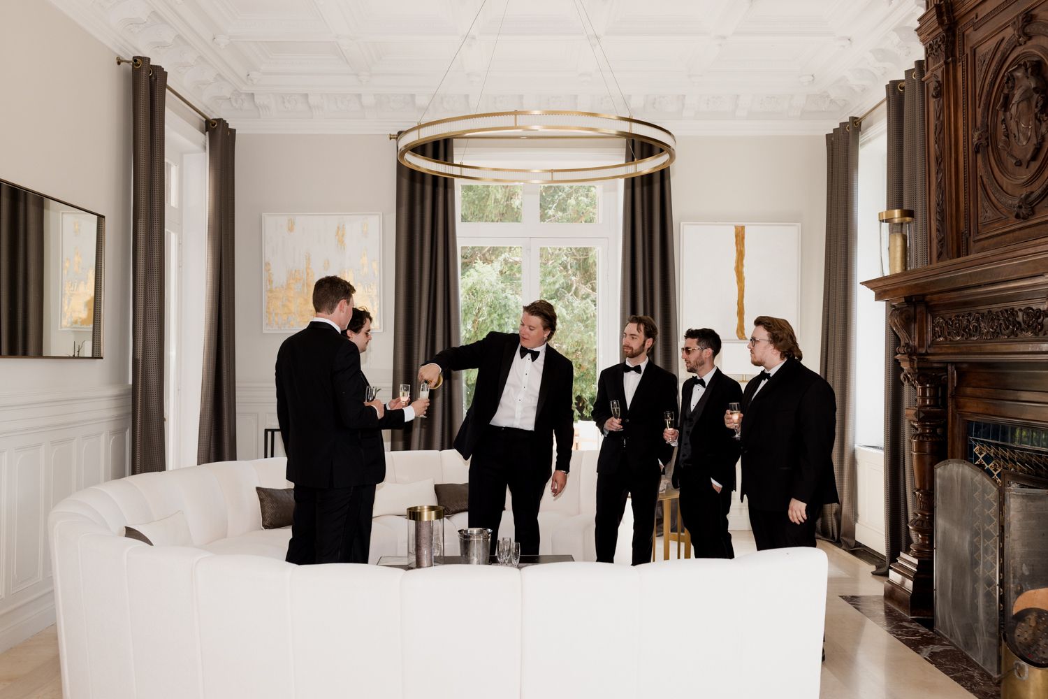 A panoramic collage of wedding photos showing people gathered in an elegant white-walled room with ornate wood details.