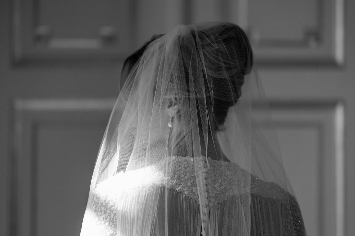 A black and white wedding photo montage showing the bride in a veil from multiple angles.