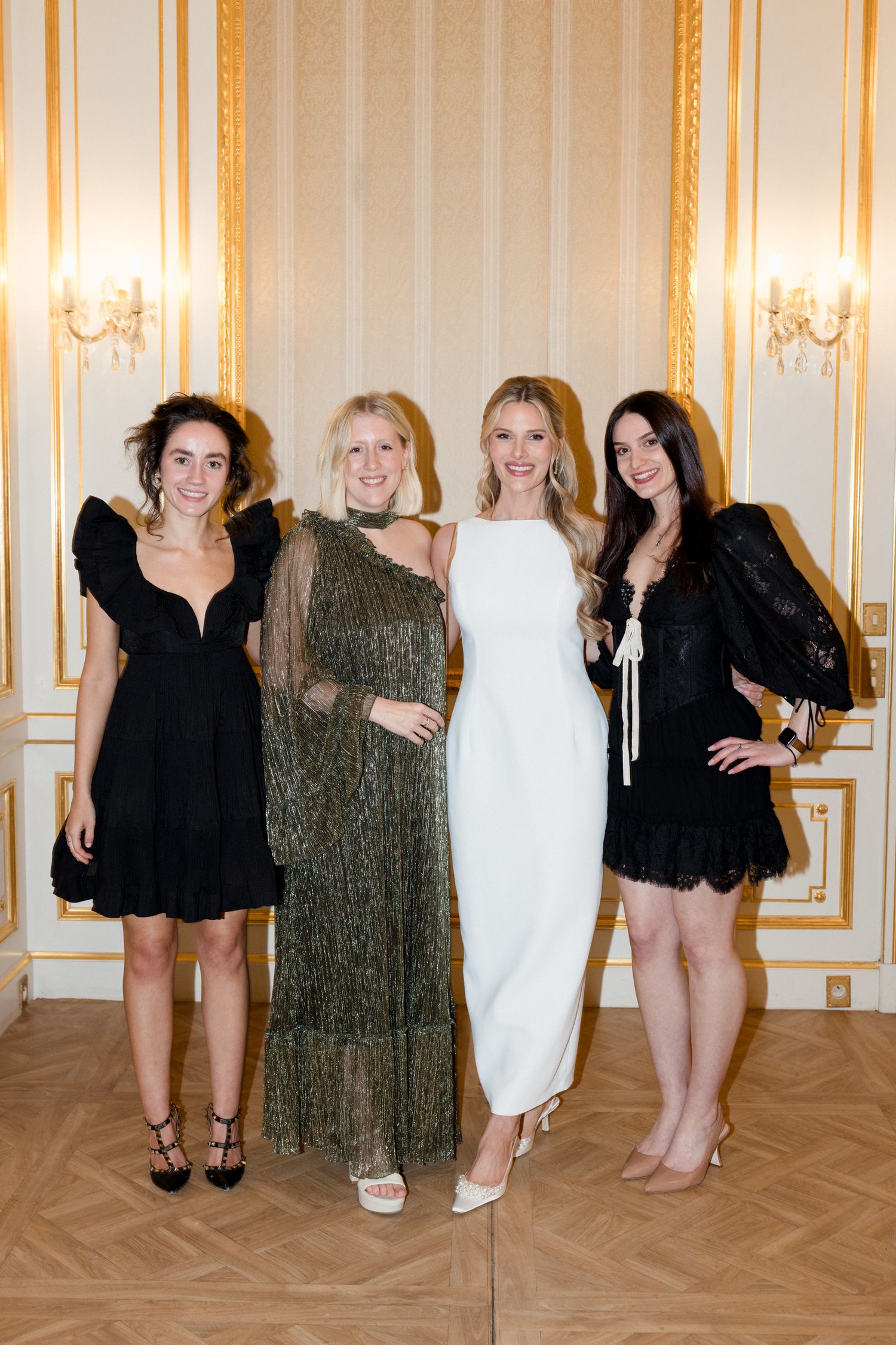 A series of fashion photos showing models in black dresses and evening wear posing in an elegant room with ornate walls.