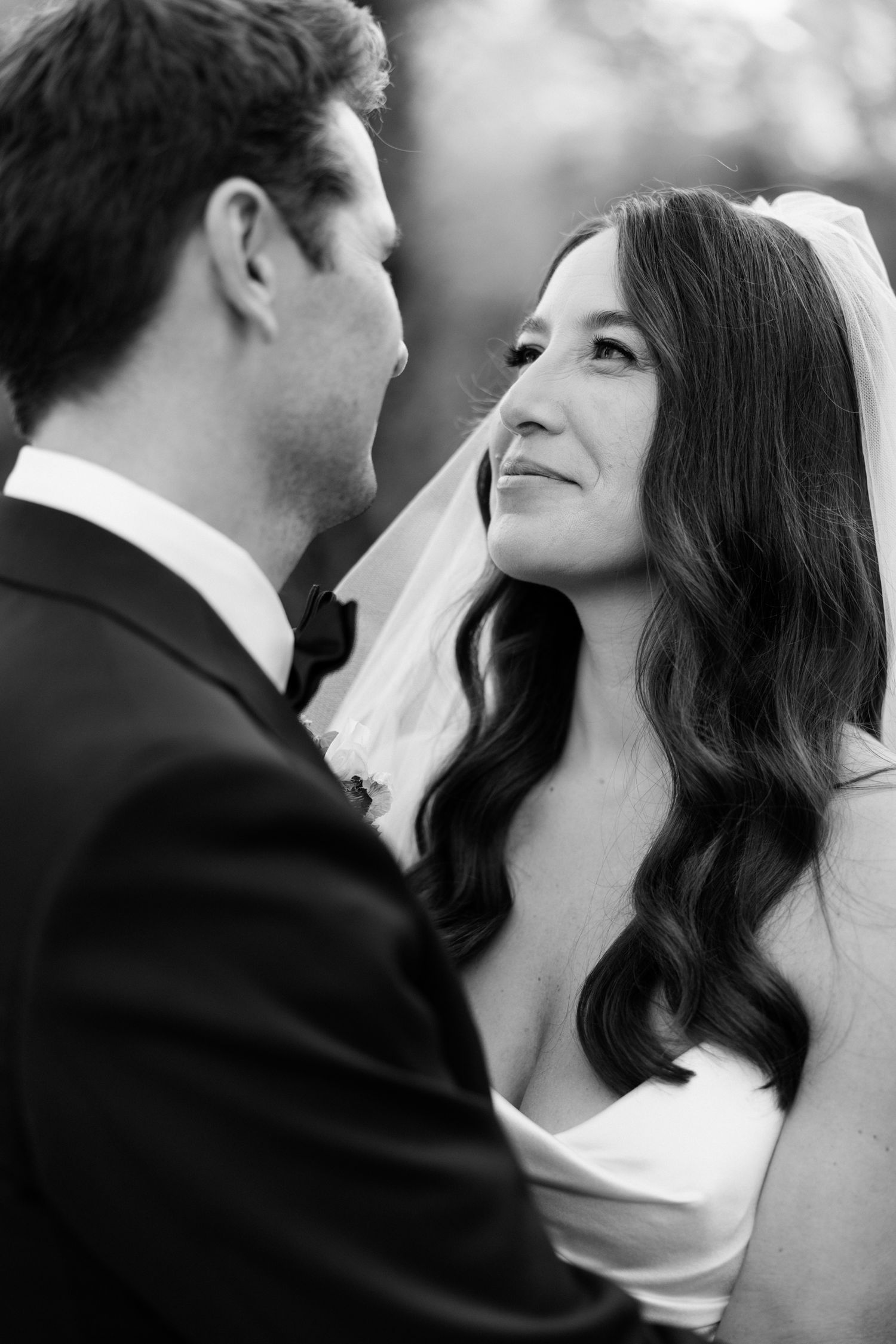 A romantic sequence of black and white wedding photos showing a couple about to kiss in multiple frames. wedding photographer france