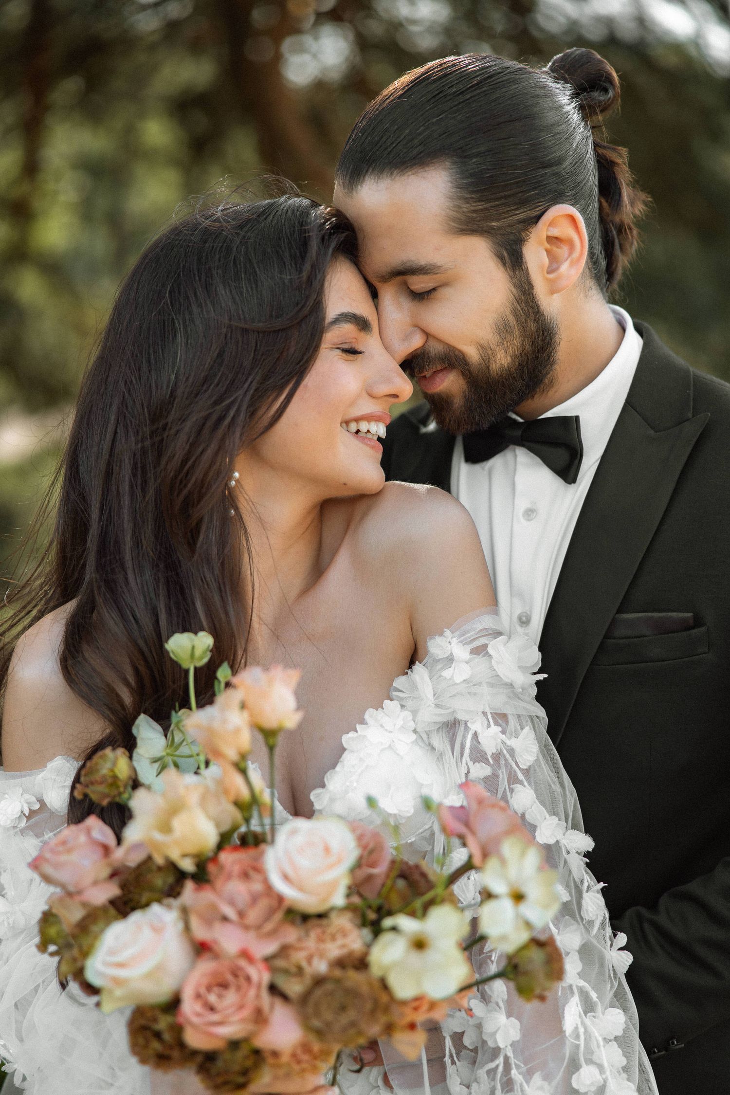 Intimate wedding portrait series showing tender moments with pastel rose bouquet.