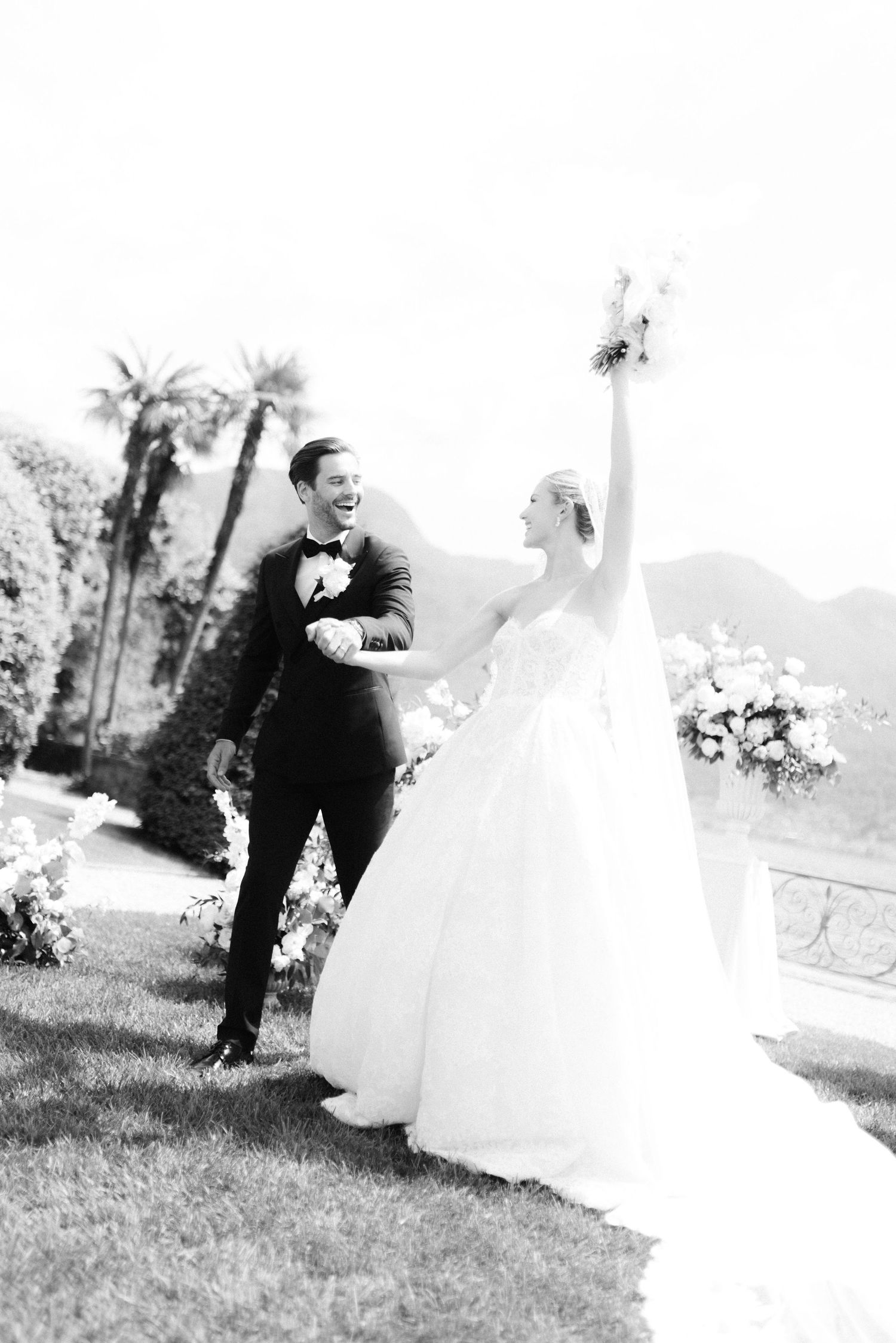 A romantic black and white wedding photo sequence shows a couple playfully running and posing together in a garden setting.