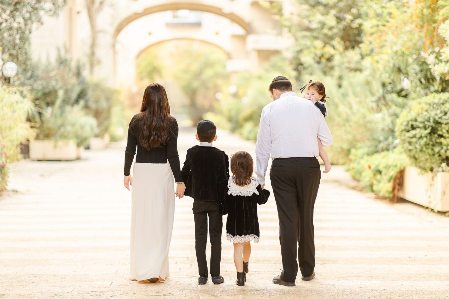 Golden family photoshoot in davids village in Jerusalem