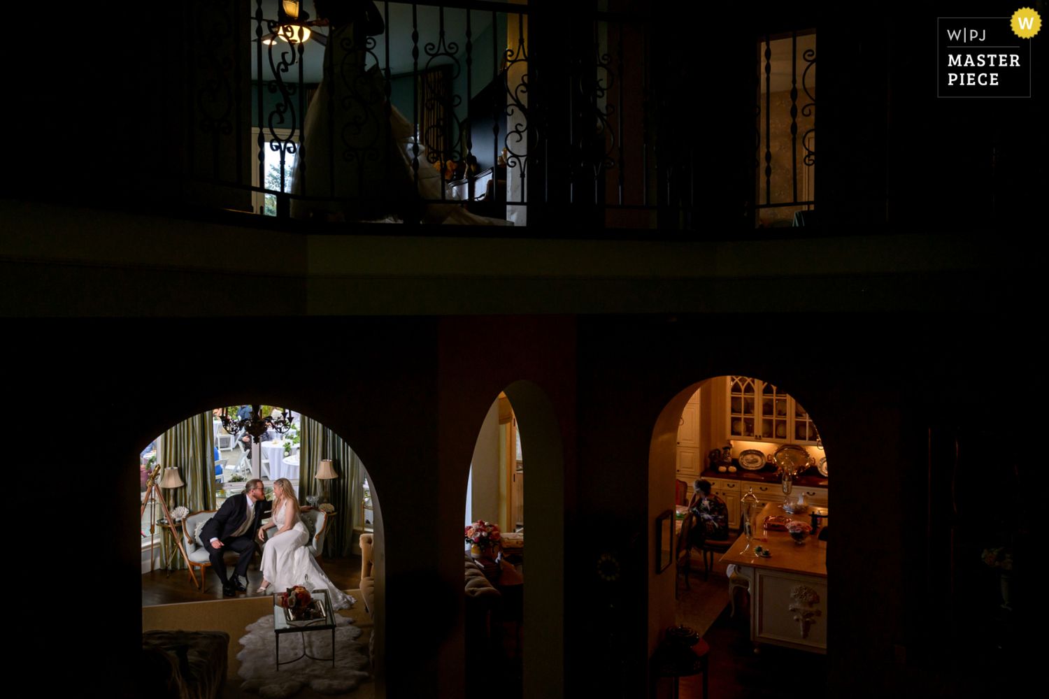 Creative, dark documentary wedding photography WPJA award winning moment of bride and groom in the home where they were married