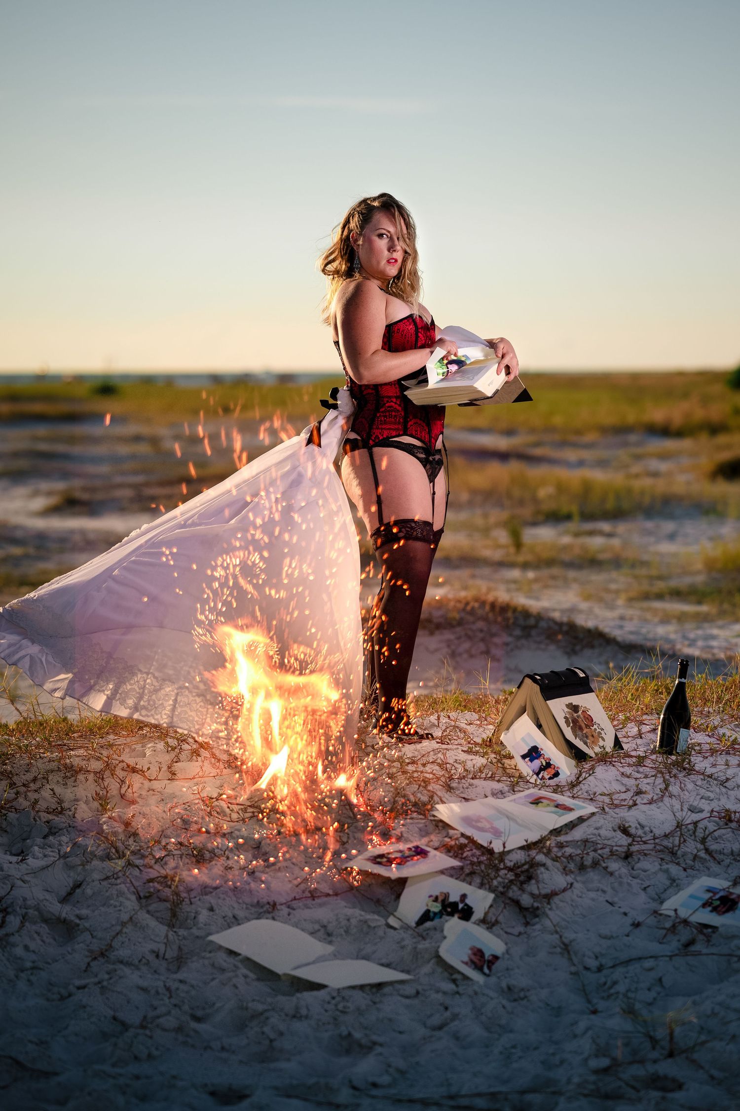 A series of photos showing papers being burned on a beach at sunset with dramatic flame effects.