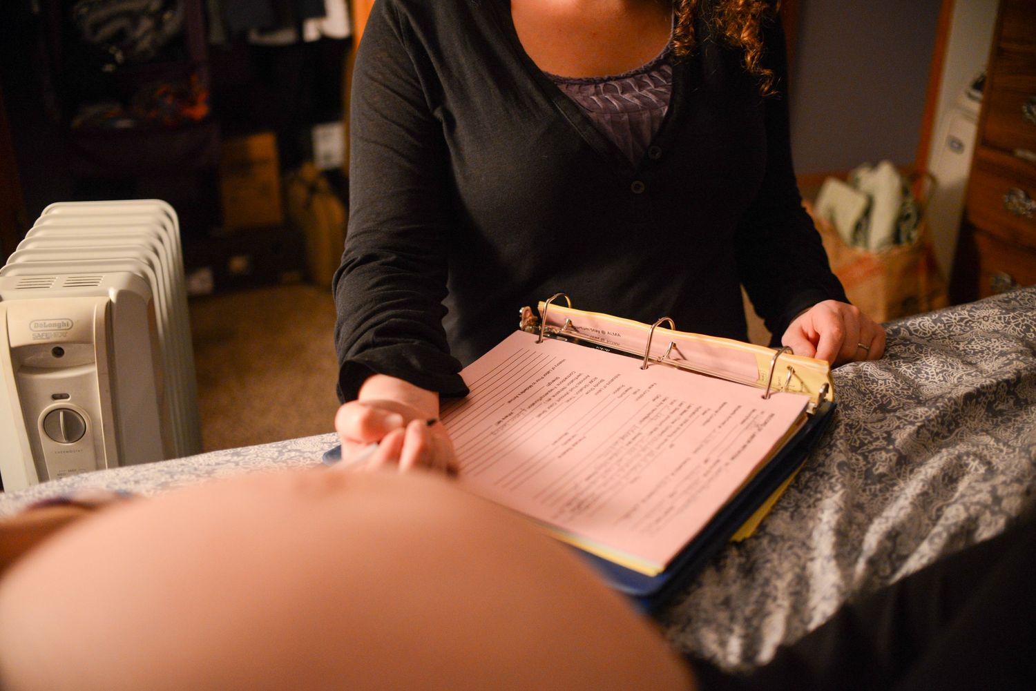 Medical professionals review paperwork and documents at a healthcare facility.
