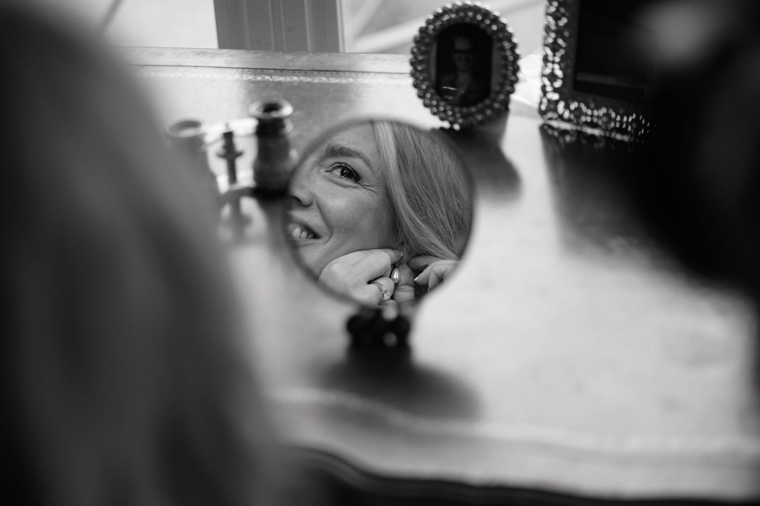 Close up artistic black and white photograph showing decorative details in soft focus with dramatic lighting.