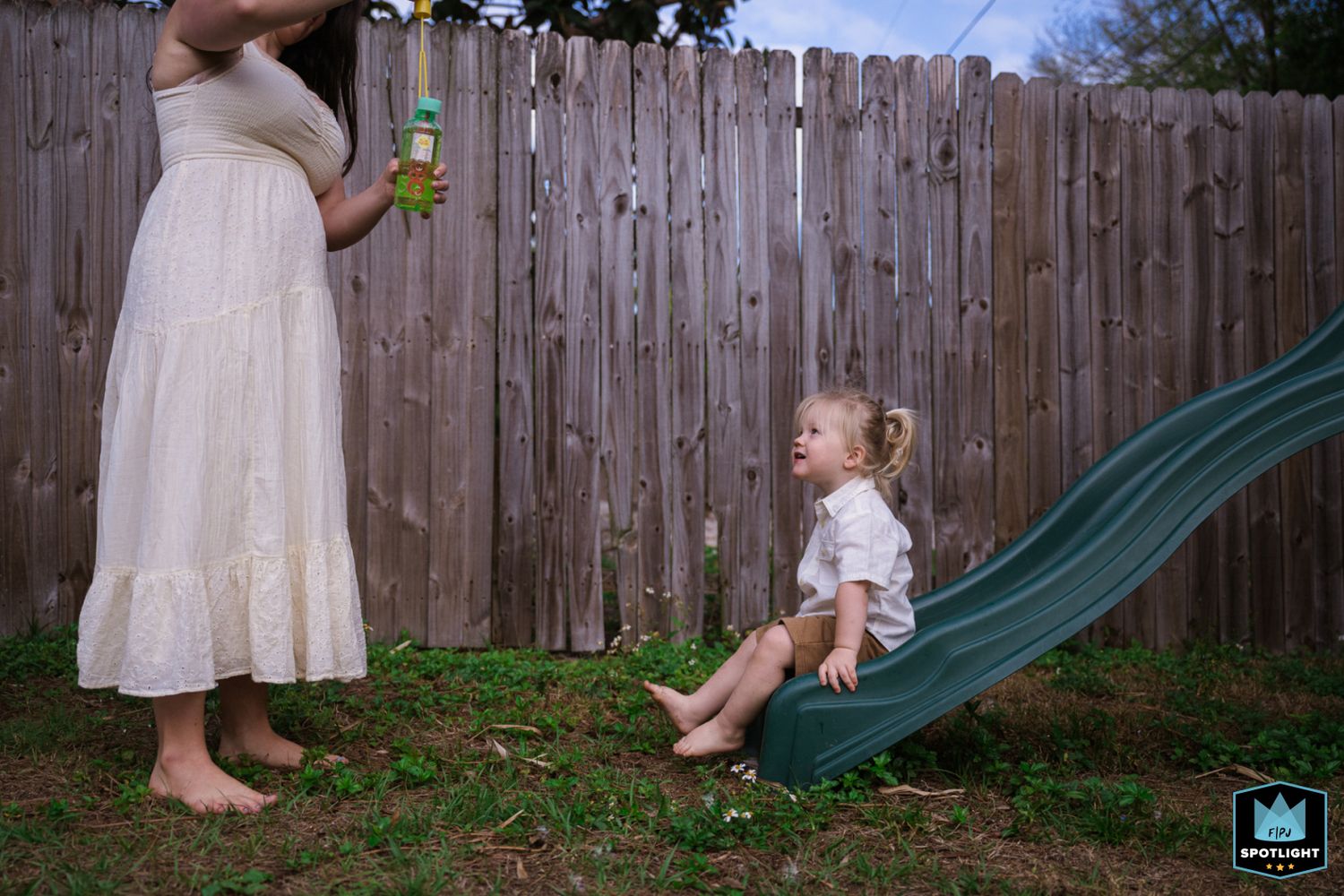 A sequence of photos showing a person in a white dress playing with bubbles in a backyard with a wooden fence.
